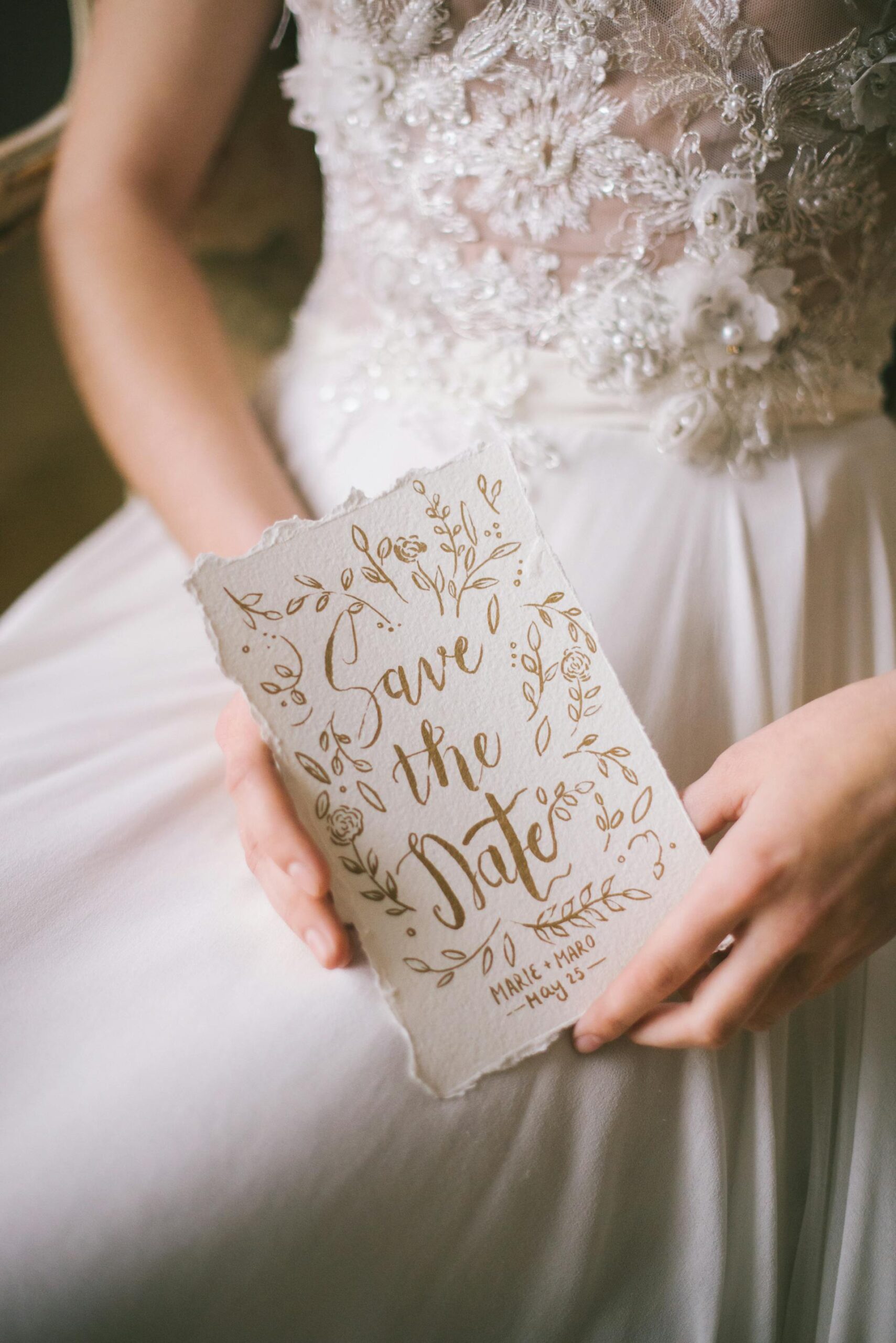 A closeup of a bride holding a wedding invitation | Source: Pexels