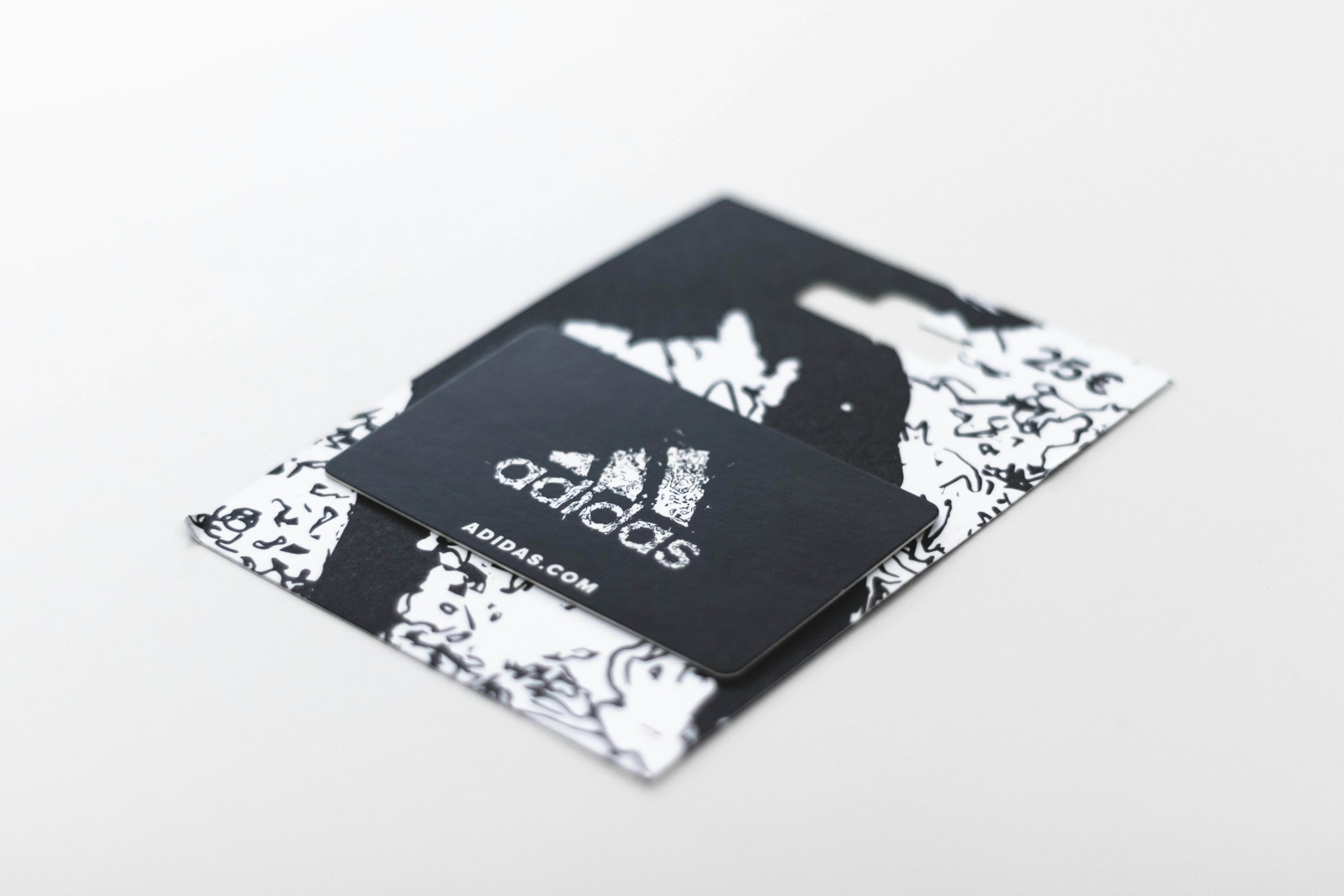 An Adidas coupon card | Source: Unsplash