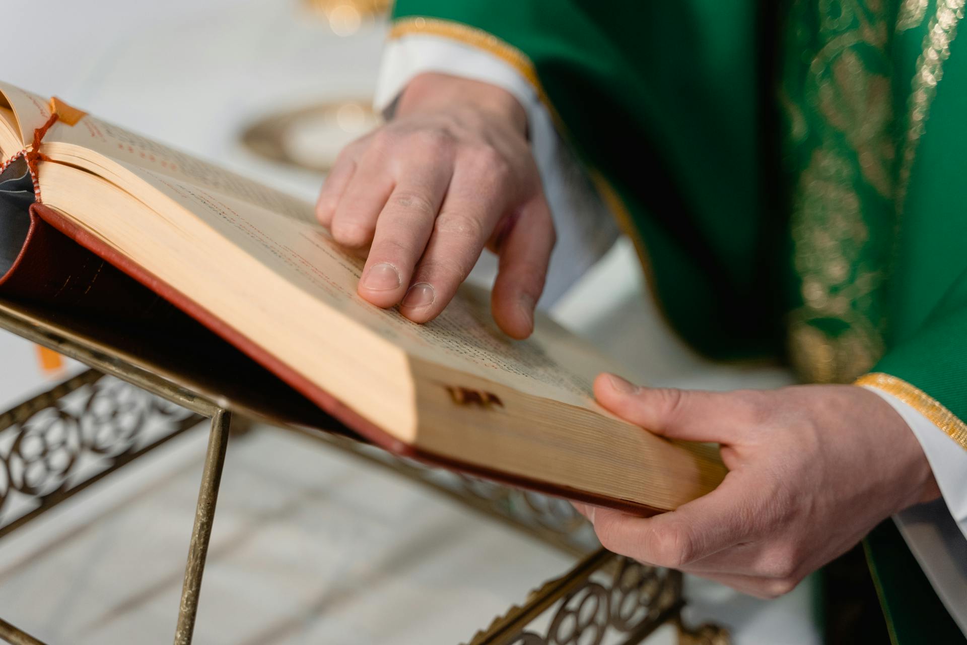 A close-up of a priest reading a book | Source: Pexels