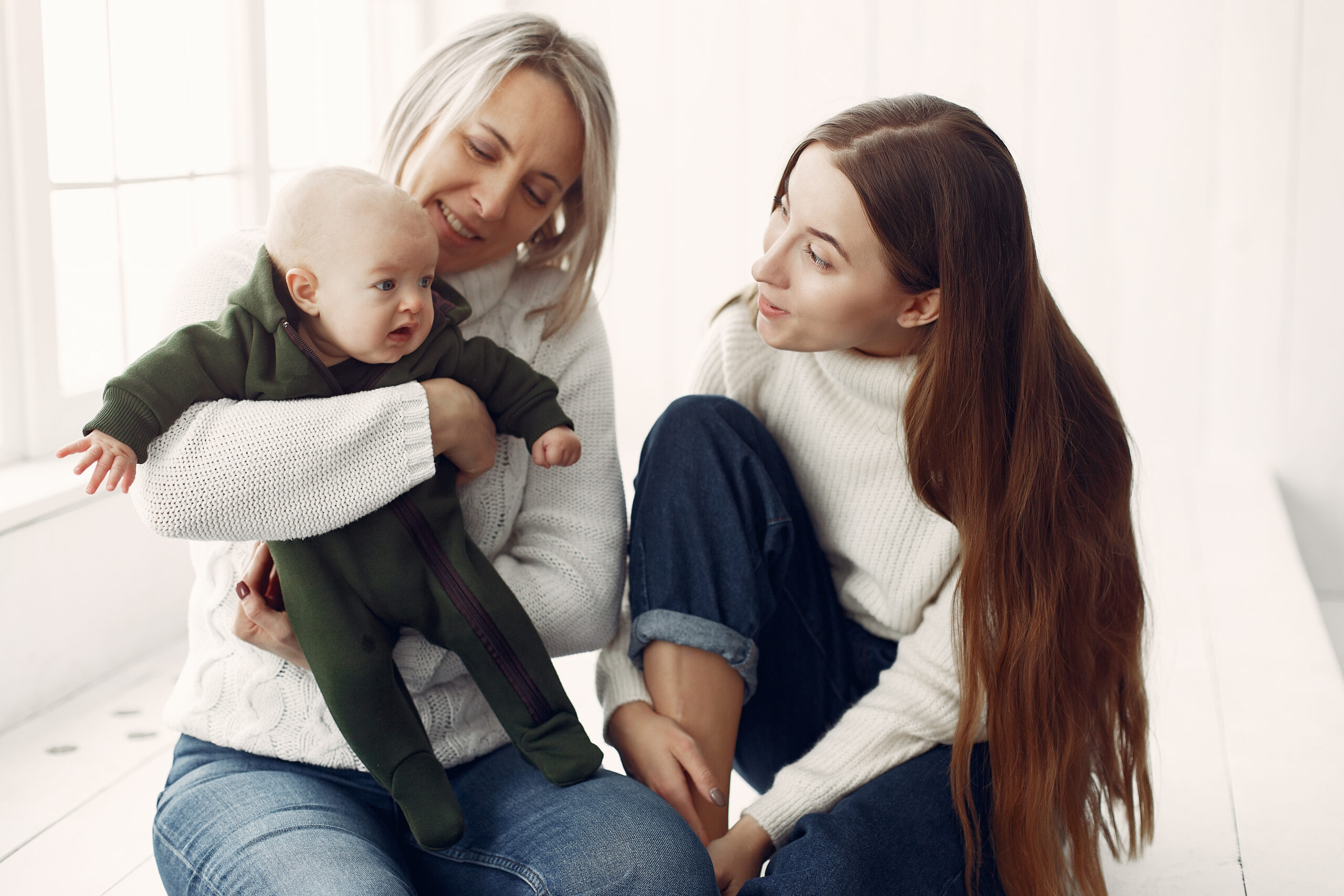 A young mother with her mother and son | Source: Shutterstock