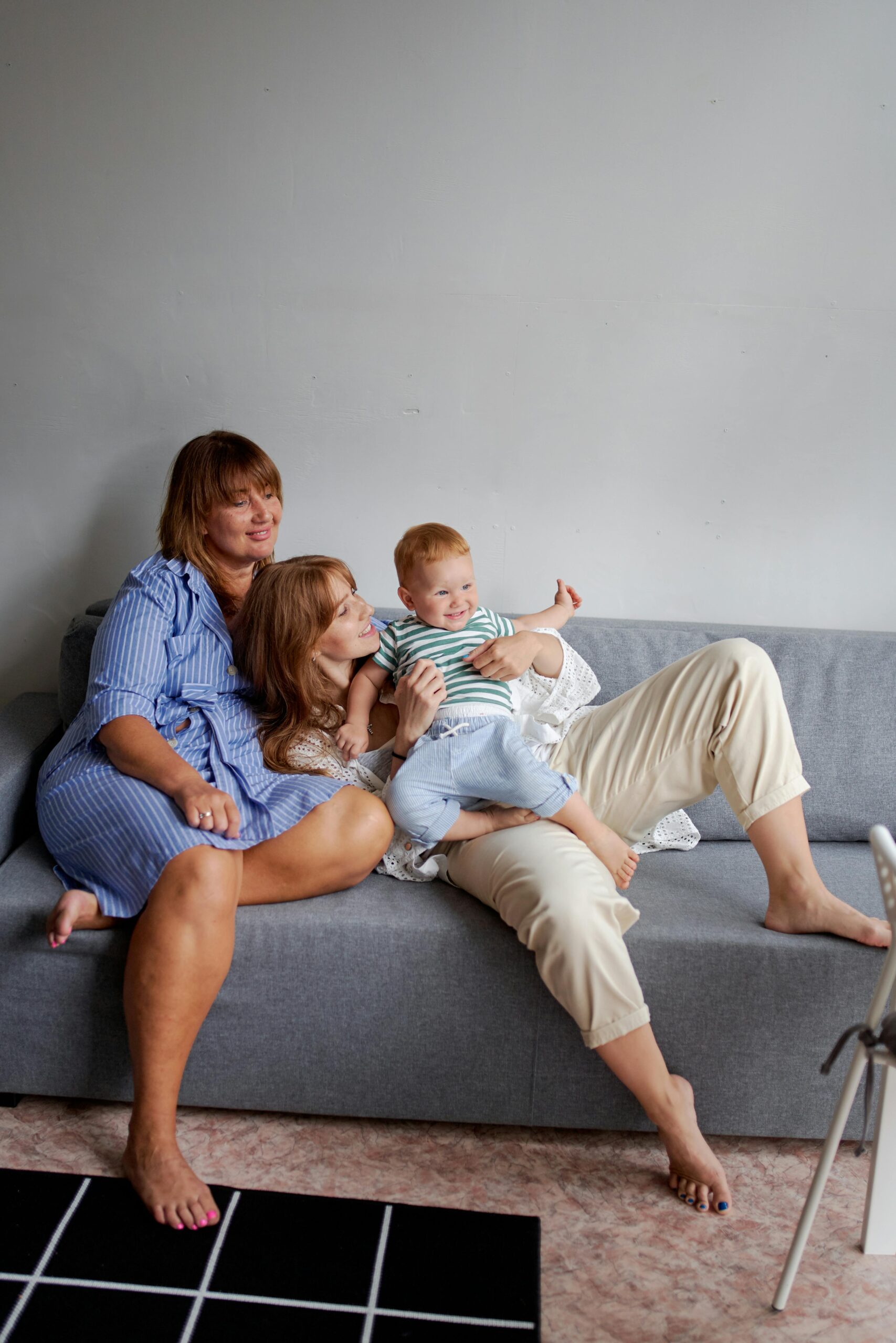 A woman and her mother playing her with her son | Source: Pexels