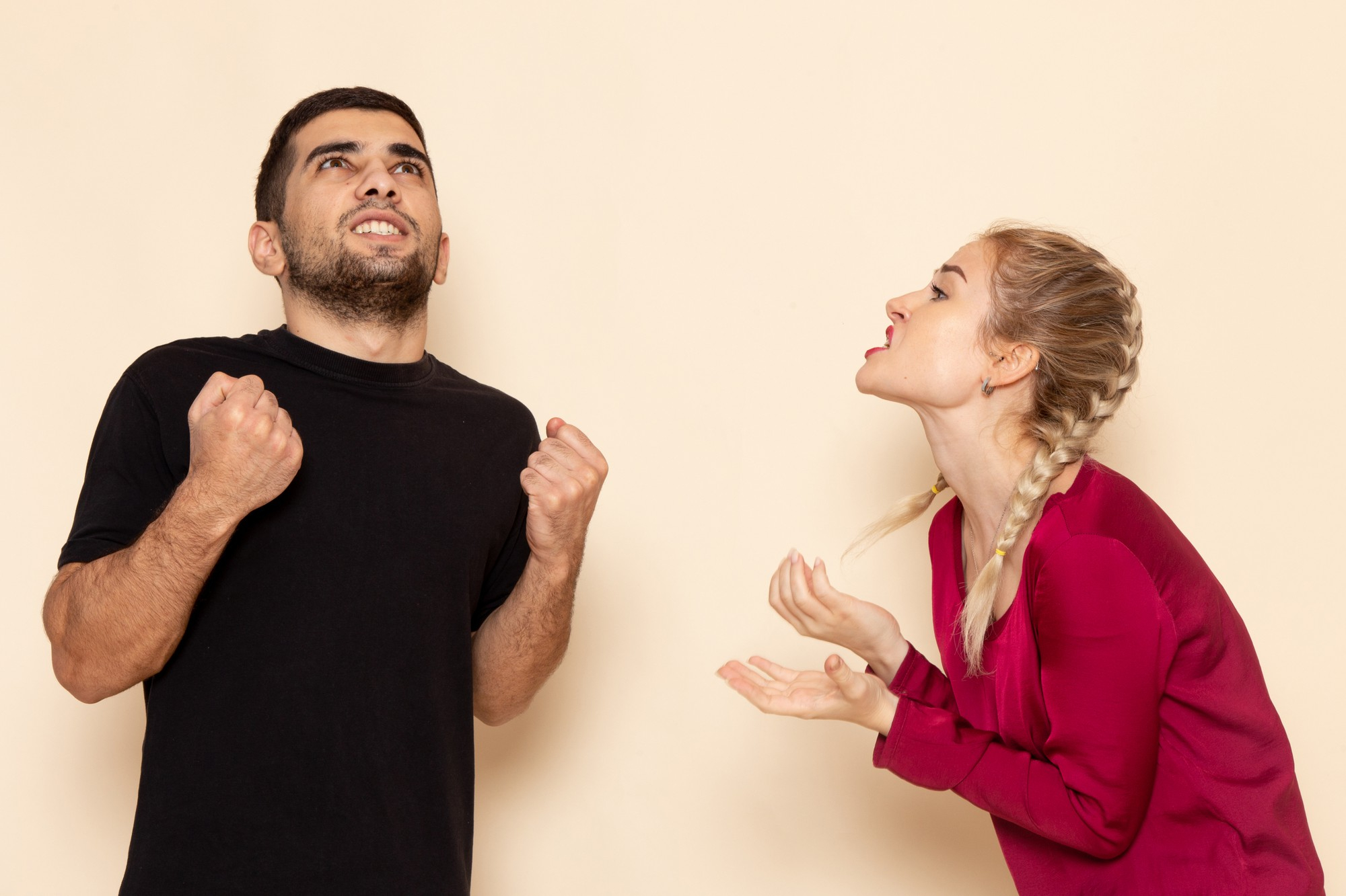 A couple having a tense argument | Source: Freepik