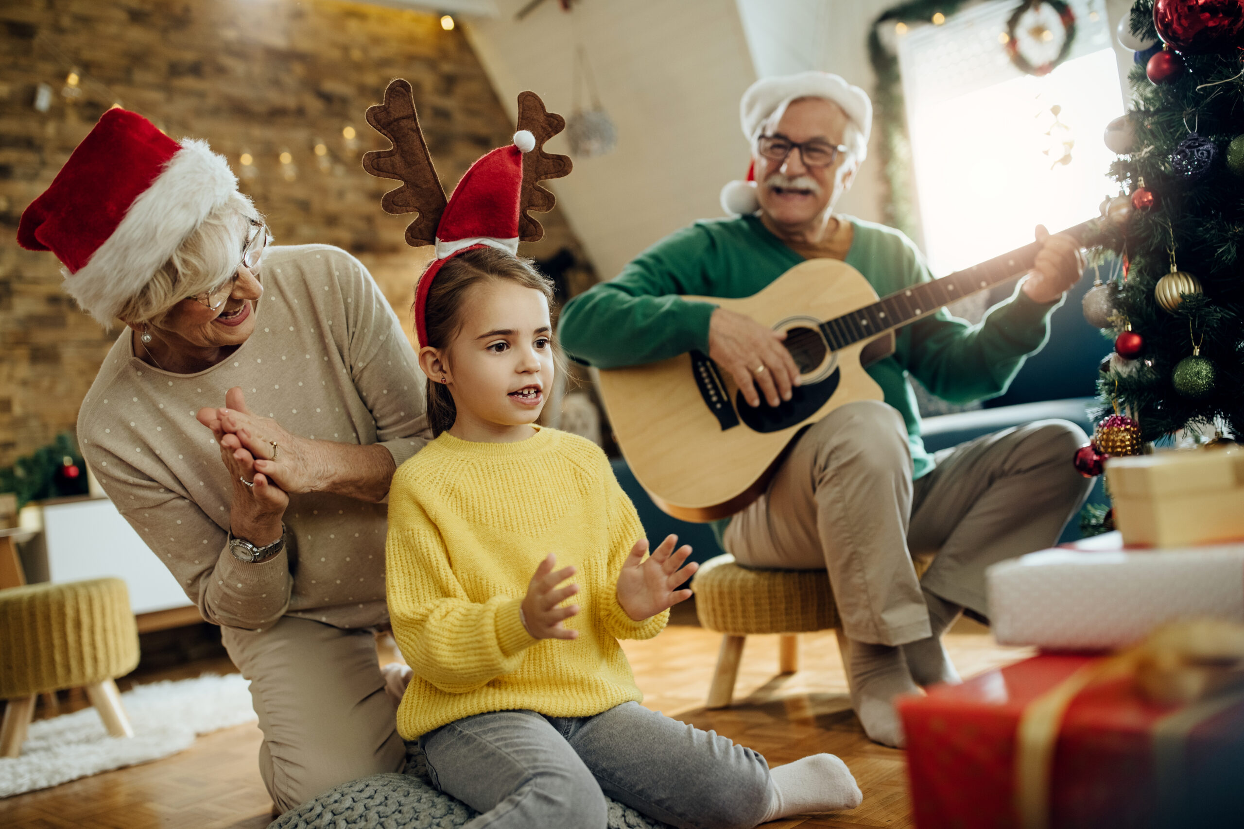 A little girl bonding with her grandparents | Source: Shutterstock