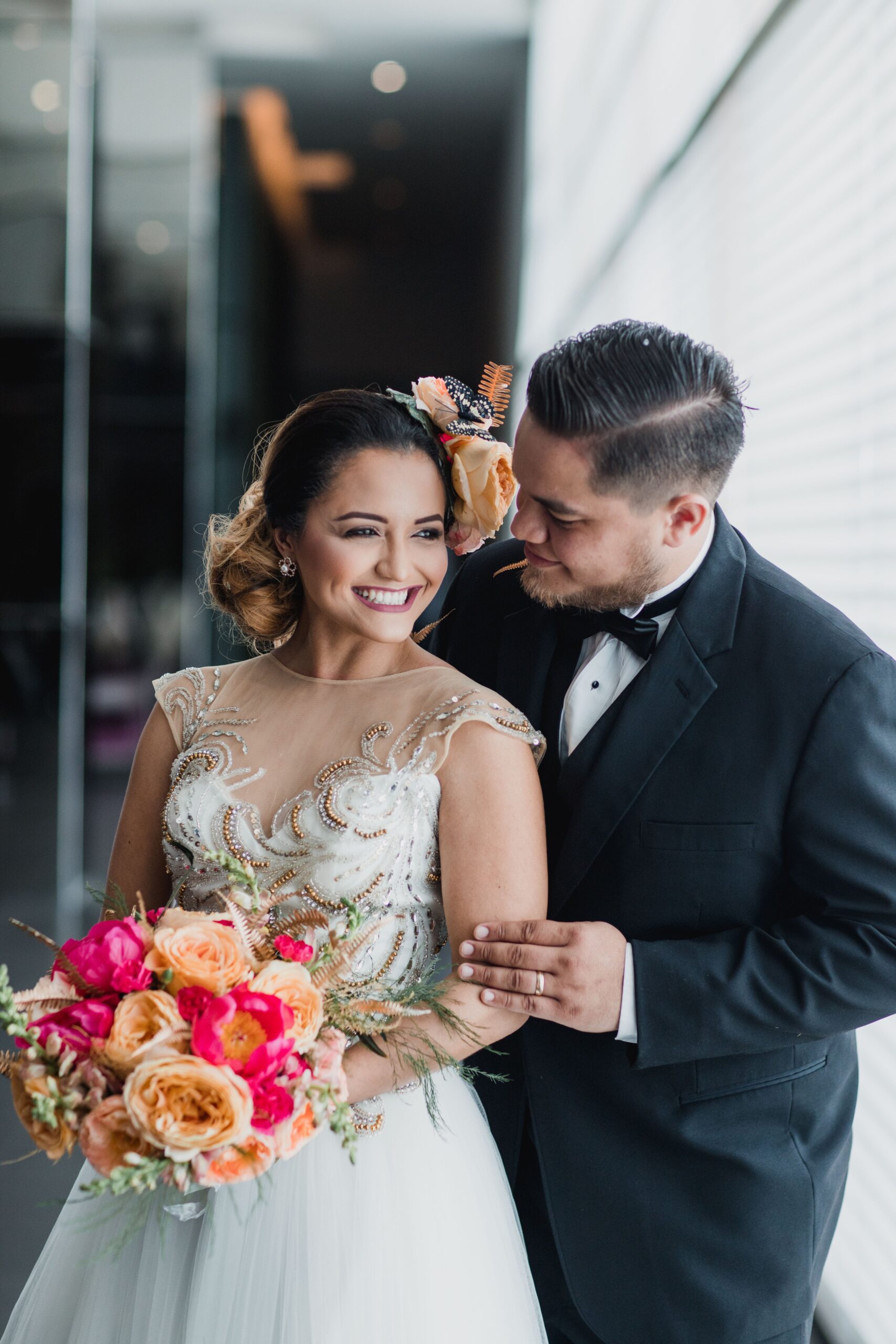 The bride and groom standing beside the window | Source: Pexels