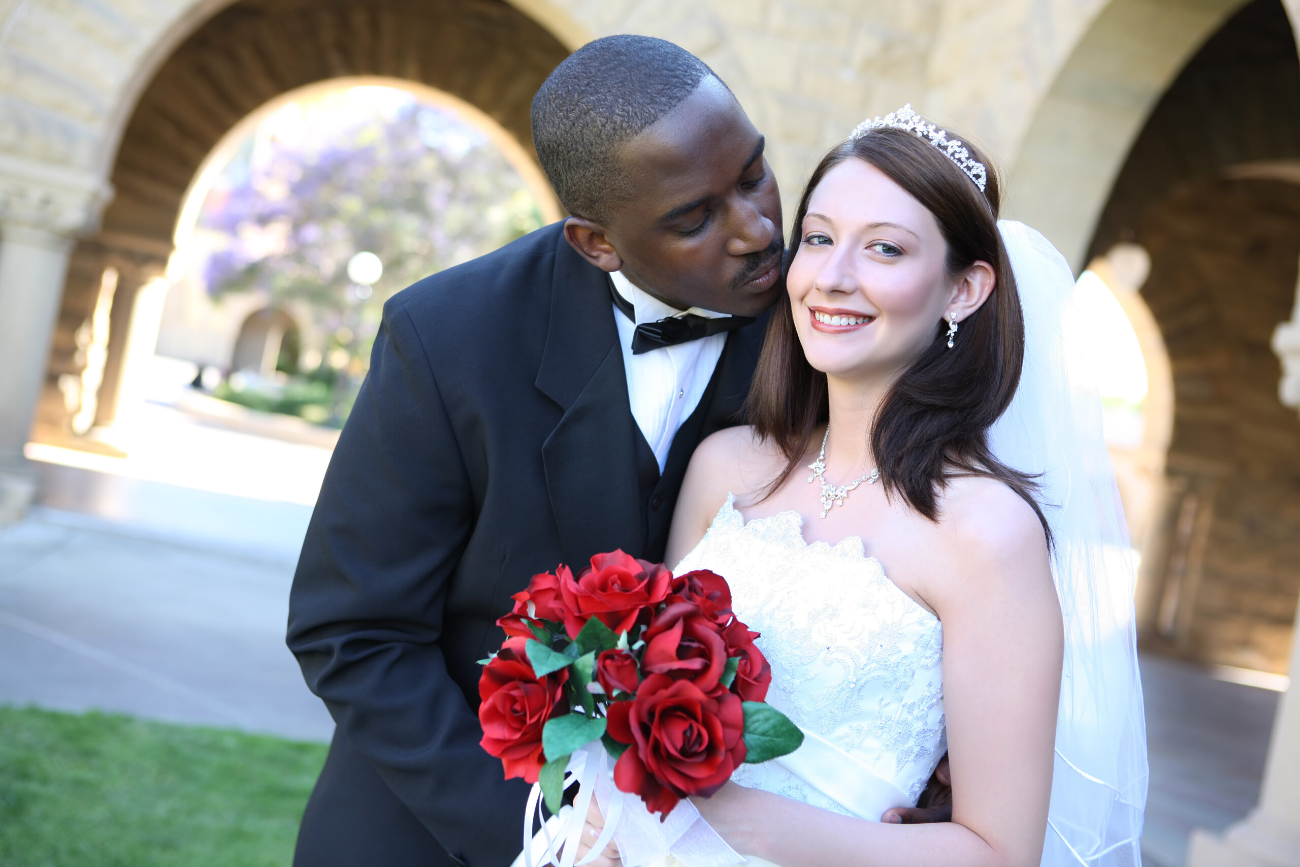 A happy interracial couple on their wedding day | Source: Shutterstock