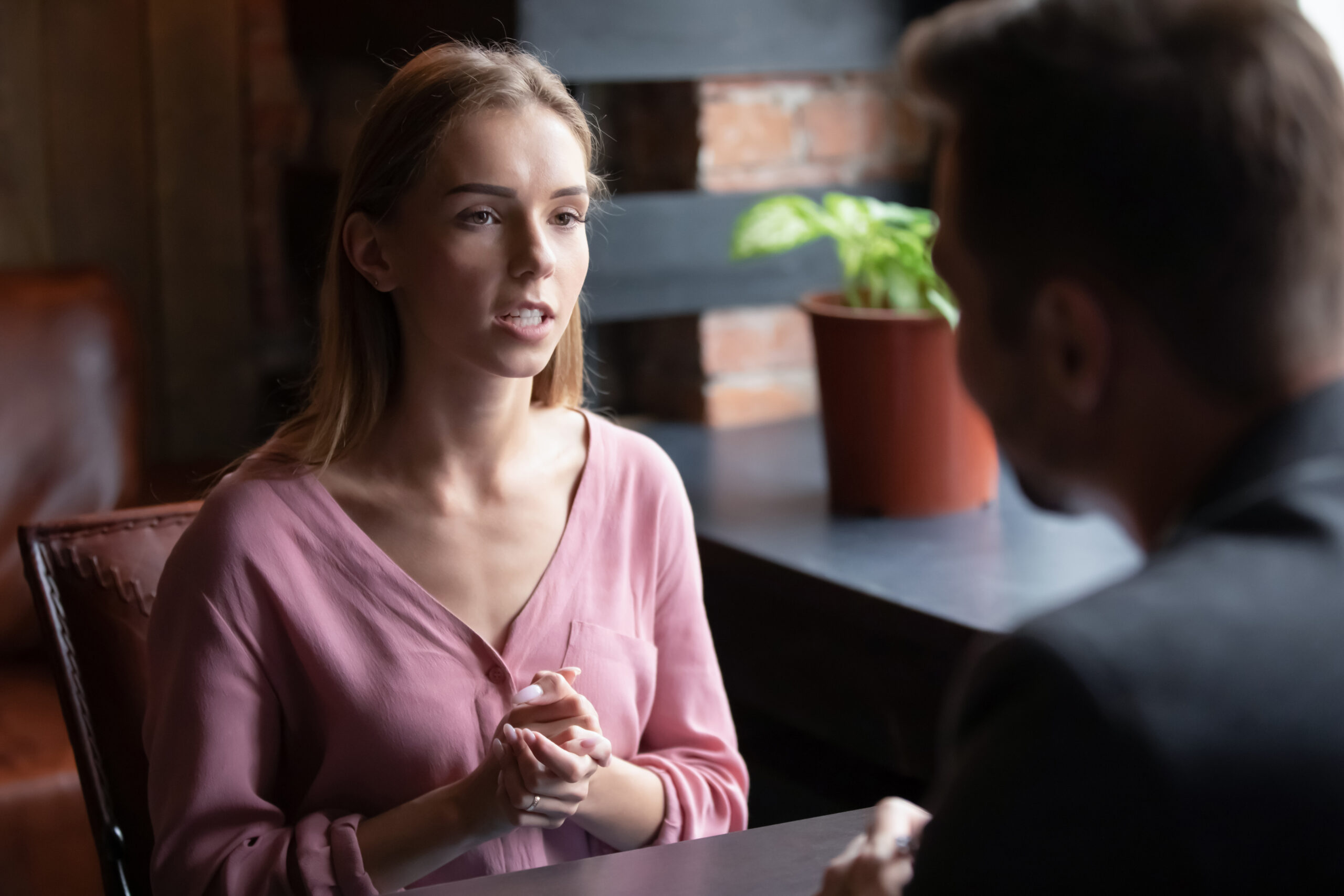 A young woman is talking to a man | Source: Shutterstock