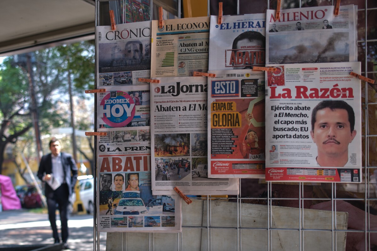 Newspapers hang on display for sale in Mexico City