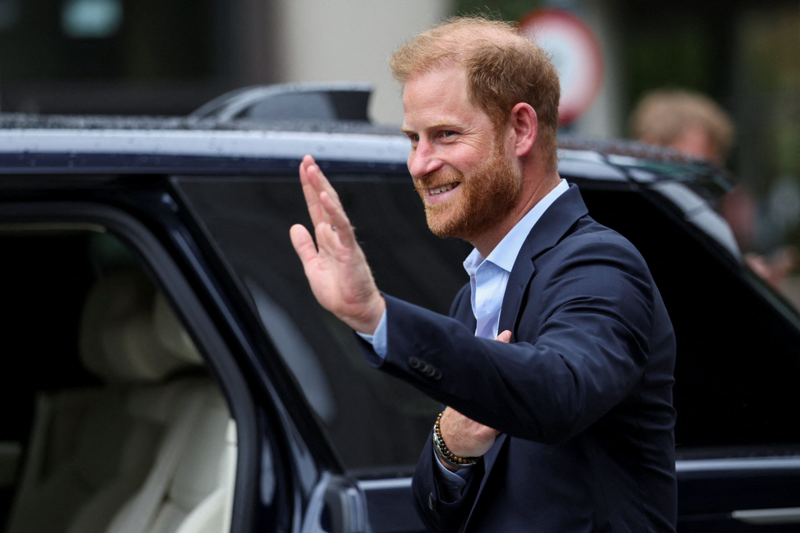 Prince Harry waves as he departs following a visit to the Centre for Blast Injury Studies at Imperial College, London on September 10, 2025