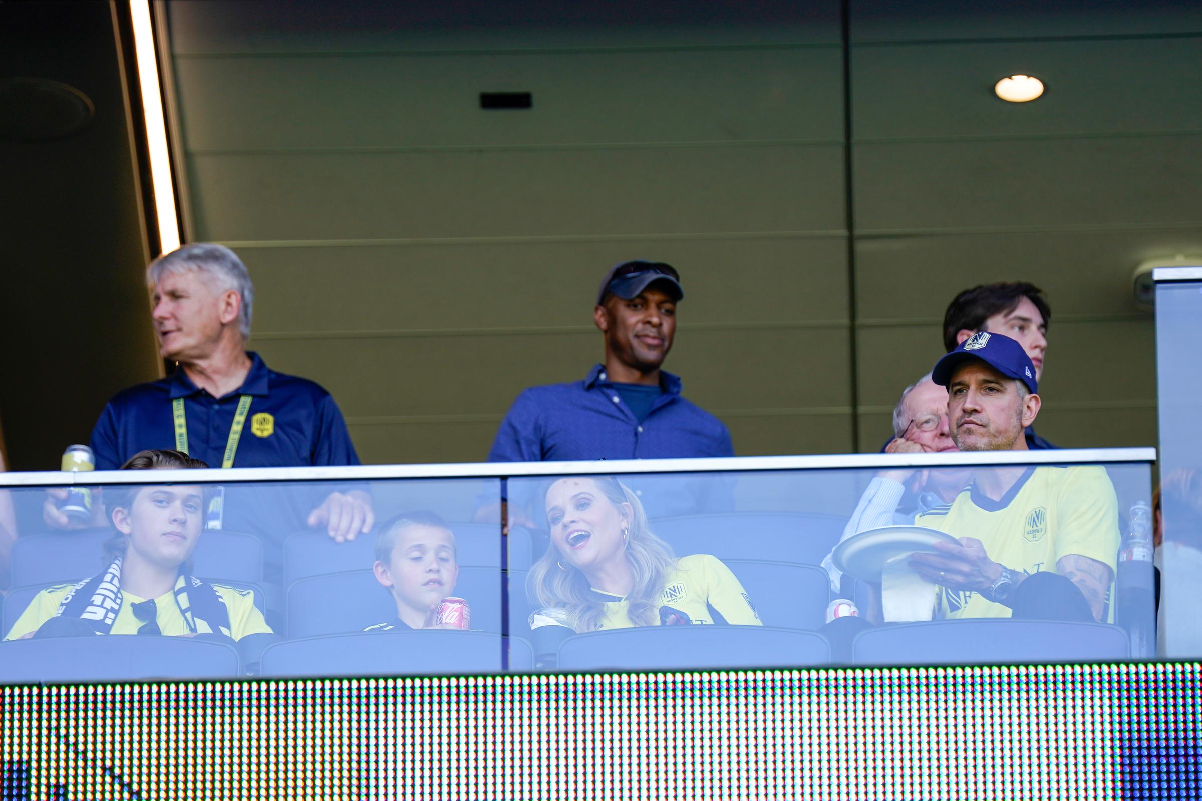 Reese Witherspoon watches Nashville SC's home opener with Deacon Phillippe, Tennessee Toth, and Jim Toth from a suite at GEODIS Park in Nashville.