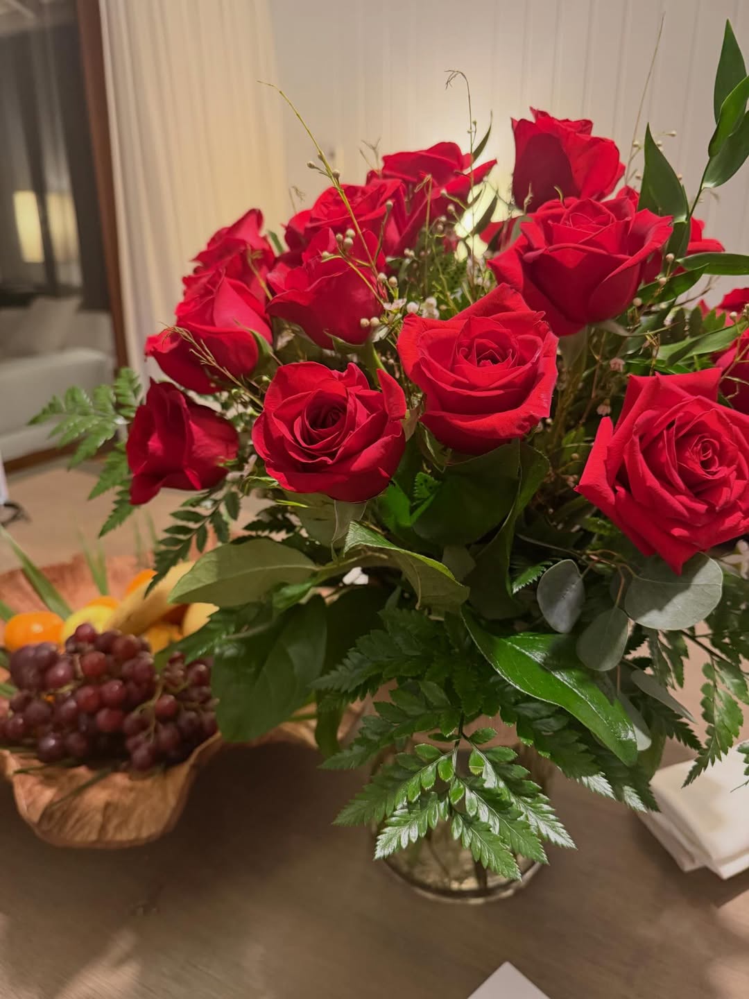 A bouquet of red roses sits beside a bowl of fresh fruit on a table inside Richard Gere and Alejandra Silva's Spain home, offering a glimpse of the family's interior décor.