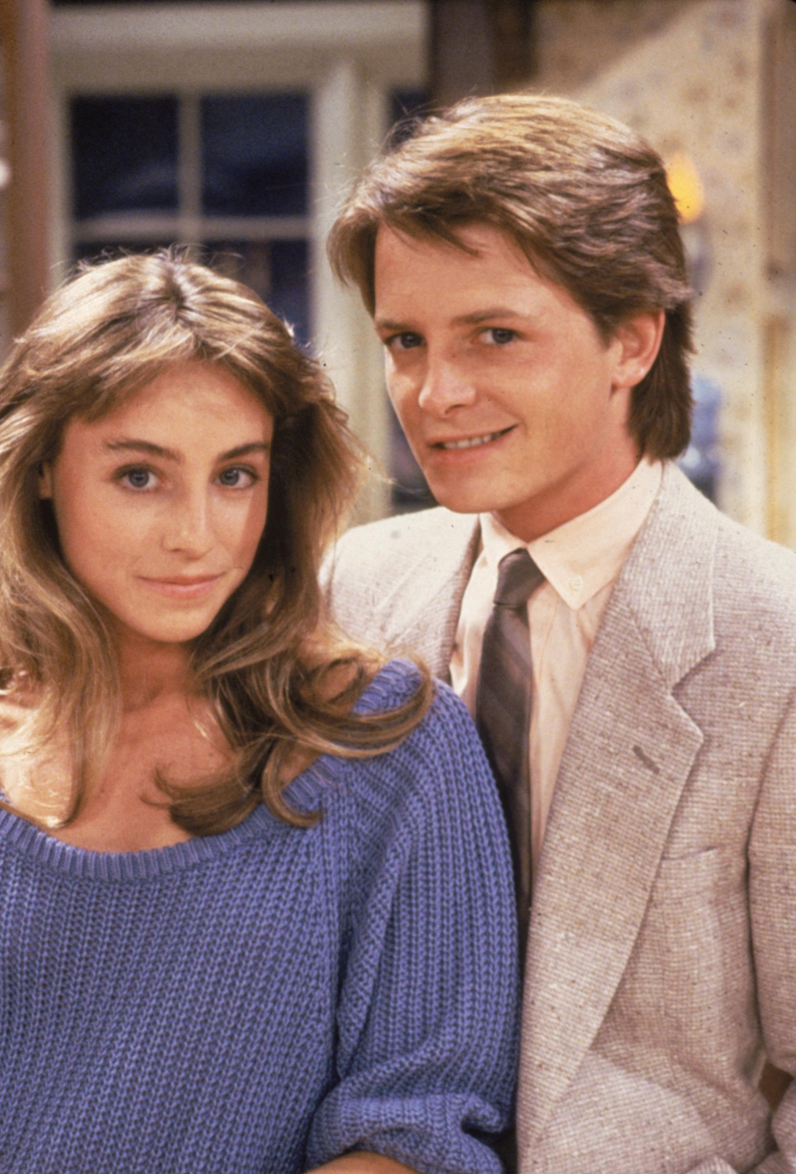 Captured on the set of the hit NBC sitcom "Family Ties," this promotional portrait marks the beginning of their historic journey. Pollan joined the show as Ellen Reed, the bright, feminist college student who stole the heart of Fox’s iconic character, Alex P. Keaton.
