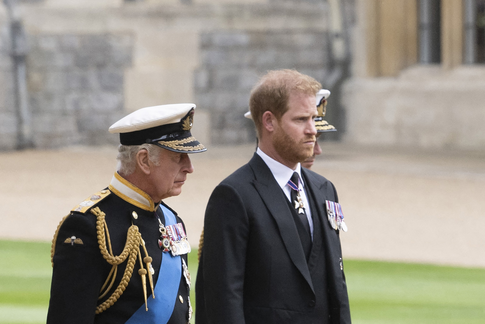 Britain's King Charles walks with his son Prince Harry, Duke of Sussex as they arrive at St George's Chapel inside Windsor Castle, England on September 19, 2022
