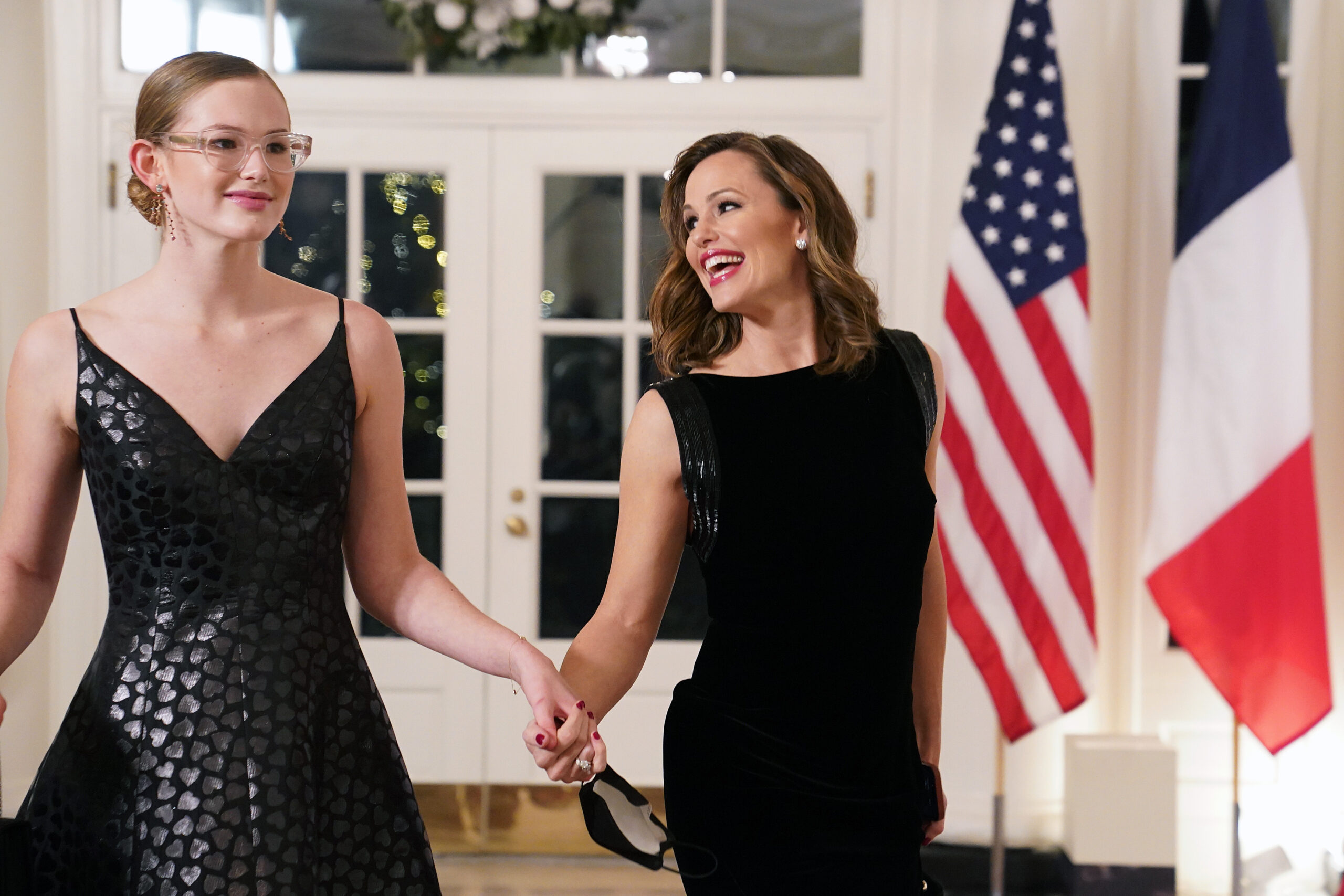 Jennifer Garner smiles at daughter Violet Affleck during a White House state dinner in December 2022. The actress has said she tried to instill a love of reading in her children, while Violet has since emerged as a public health advocate and Yale University student.