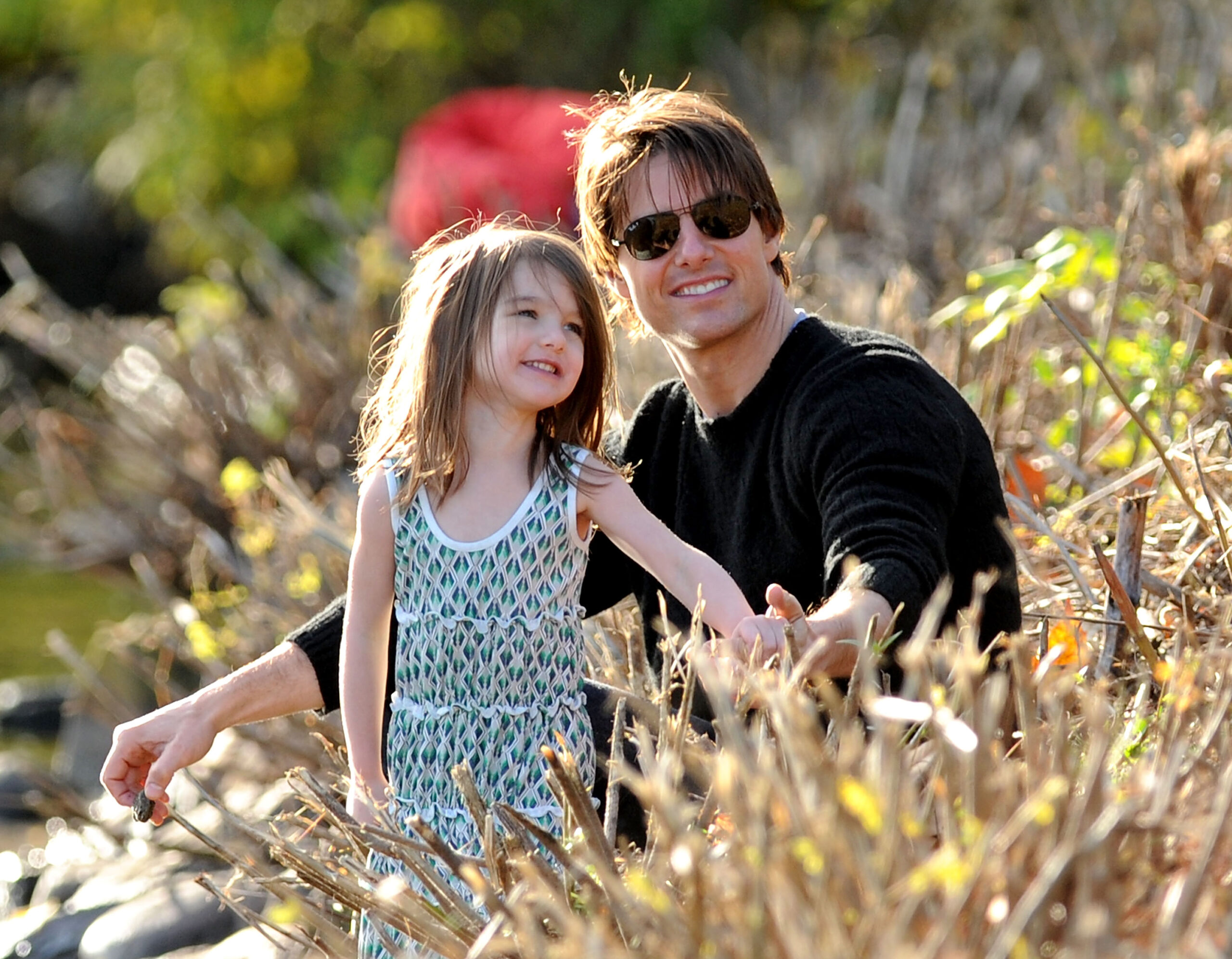 Suri and Tom Cruise at the Charles River Basin on October 10, 2009, in Cambridge, Massachusetts