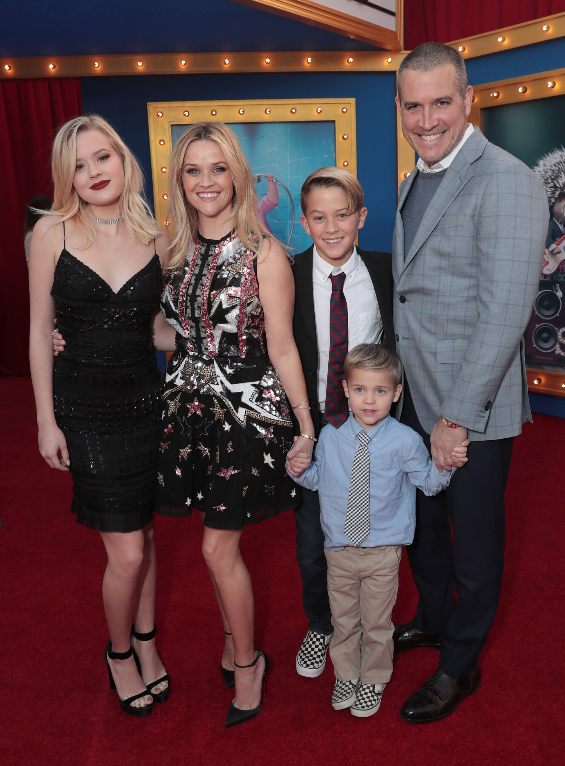 Ava Phillippe, Reese Witherspoon, Deacon Phillippe, Tennessee James Toth, and Jim Toth smile together at the premiere of Universal Pictures' "Sing" in Los Angeles.