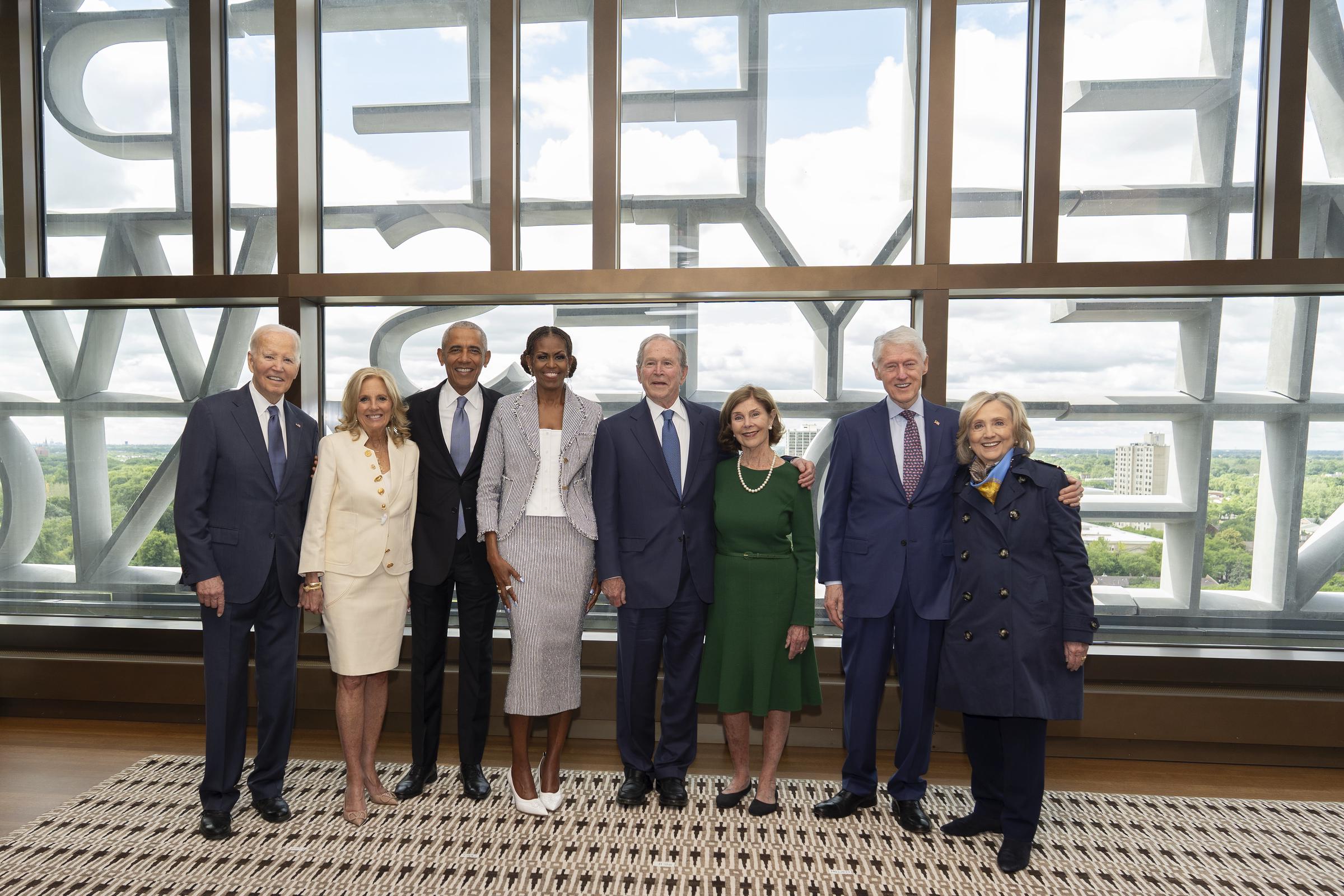 A distinguished group of political leaders gathered to honor a significant architectural milestone on the South Side, though one notable figure was missing from the historic lineup. In this photo, former President Barack Obama and former First Lady Michelle Obama, former President George W. Bush and former First Lady Laura Bush, and former President Bill Clinton and former Secretary of State Hillary Clinton posed ahead of the dedication ceremony for the opening of the Barack Obama Presidential Center at John Lewis Plaza on June 18, 2026, in Chicago, Illinois.