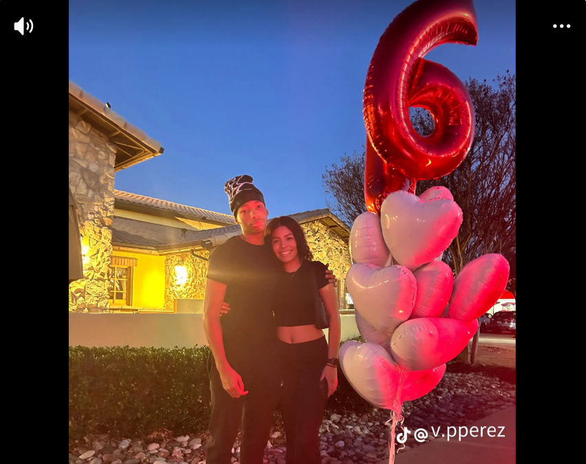 Karmelo Anthony and his girlfriend are pictured together during a celebration in another image included in the slideshow she shared in support of him.