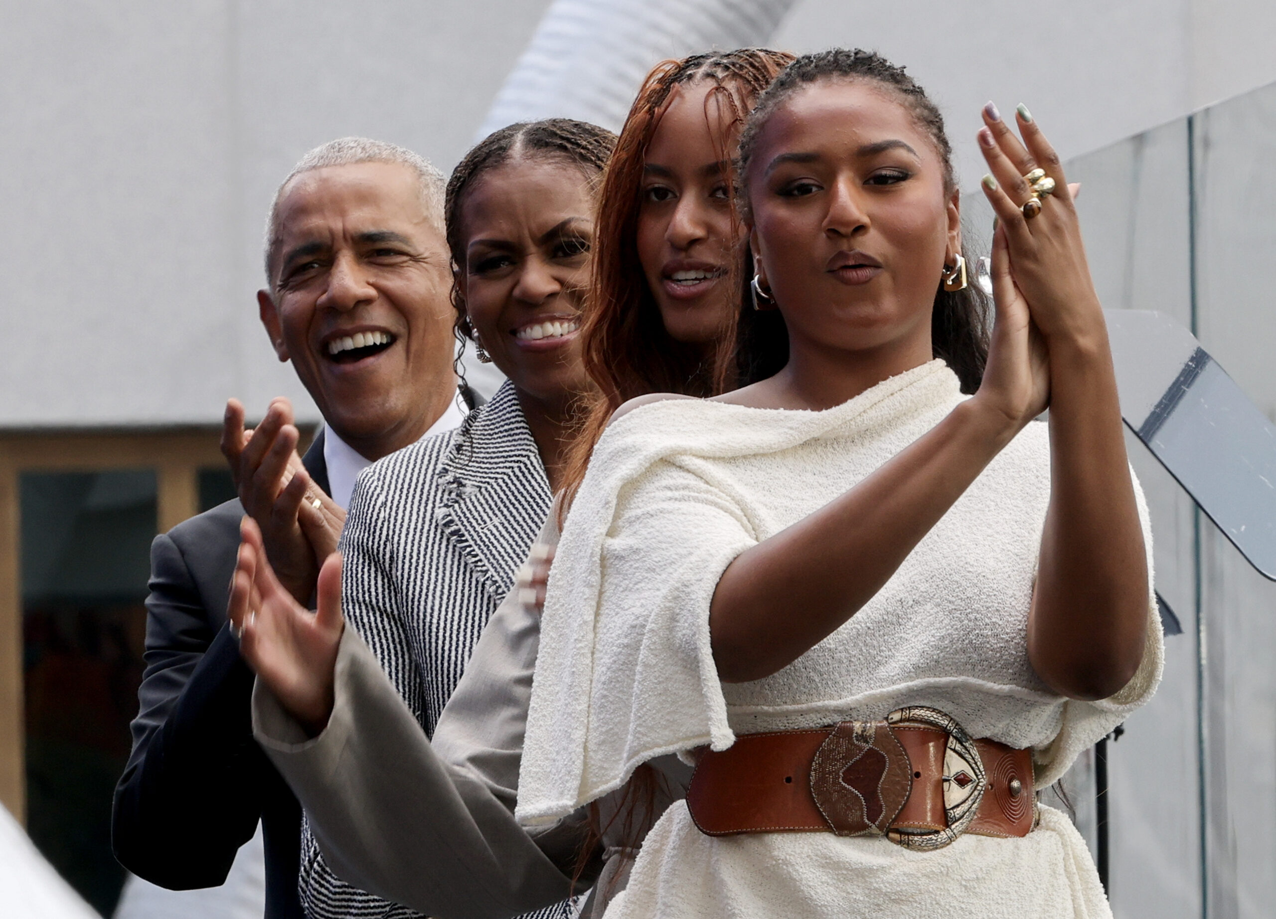 Netizens continuously noted how much the young women took after their famous parents. In this photo, the family cheered during the dedication ceremony for the opening of the Barack Obama Presidential Center at John Lewis Plaza on June 18, 2026, in Chicago, Illinois.
