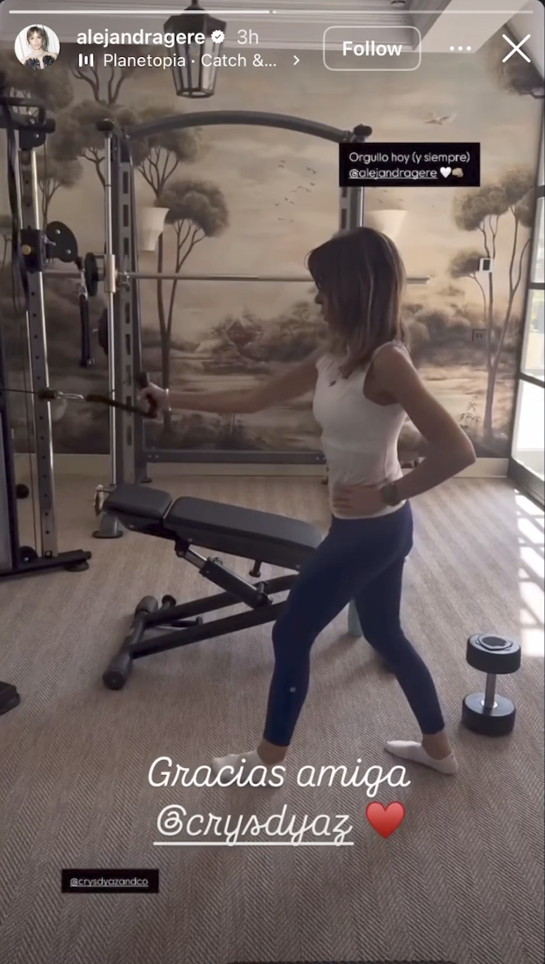 Alejandra Silva exercises in the home's private gym, which features strength-training equipment, free weights, and a mural-inspired wall design.