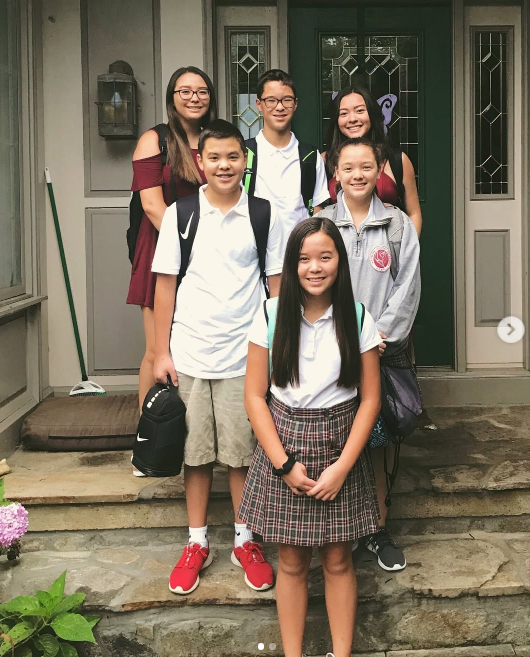 Six out of eight of the children grew up with their mother following the divorce. On this occasion, they posed together while ready for school on August 23, 2018.