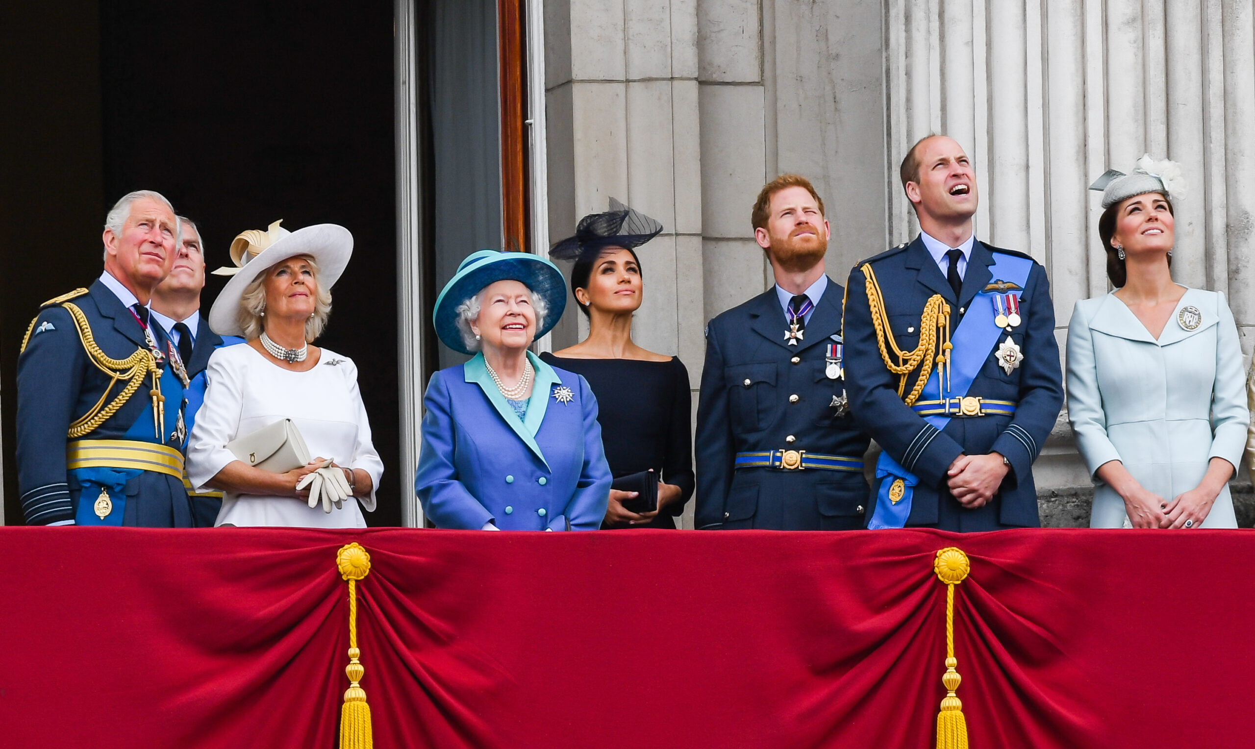 King Charles, Camilla, Queen Elizabeth ll, Meghan, Prince Harry, Prince William, and Catherine, stand on the balcony of Buckingham Palace to view a flypast to mark the centenary of the Royal Air Force (RAF)