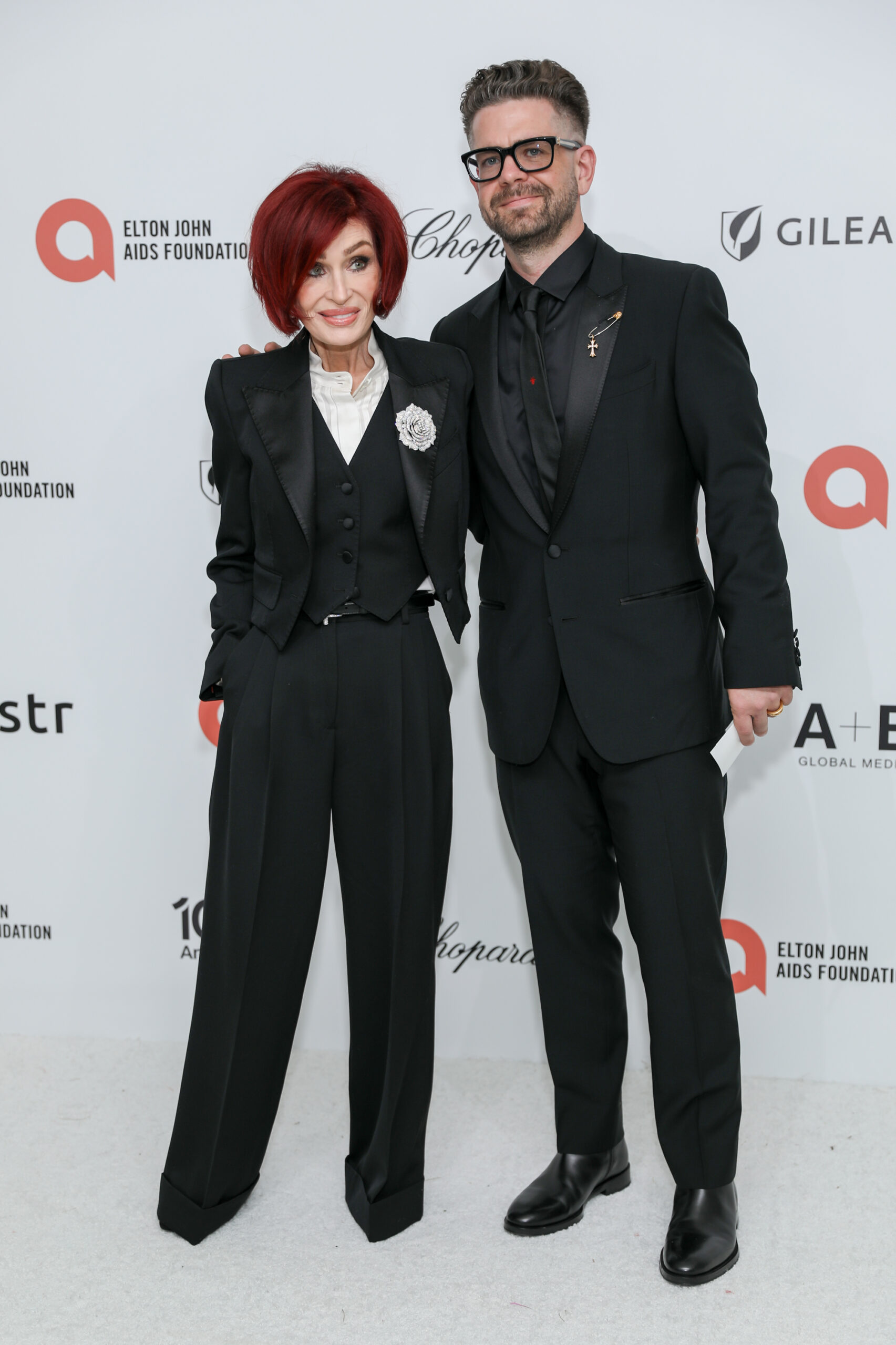 Sharon Osbourne and her son Jack Osbourne attend the Elton John AIDS Foundation Academy Awards Viewing Party in West Hollywood, California, on March 15, 2026. Jack previously reassured fans that his mother was recovering after her unexplained hospitalization in 2022.