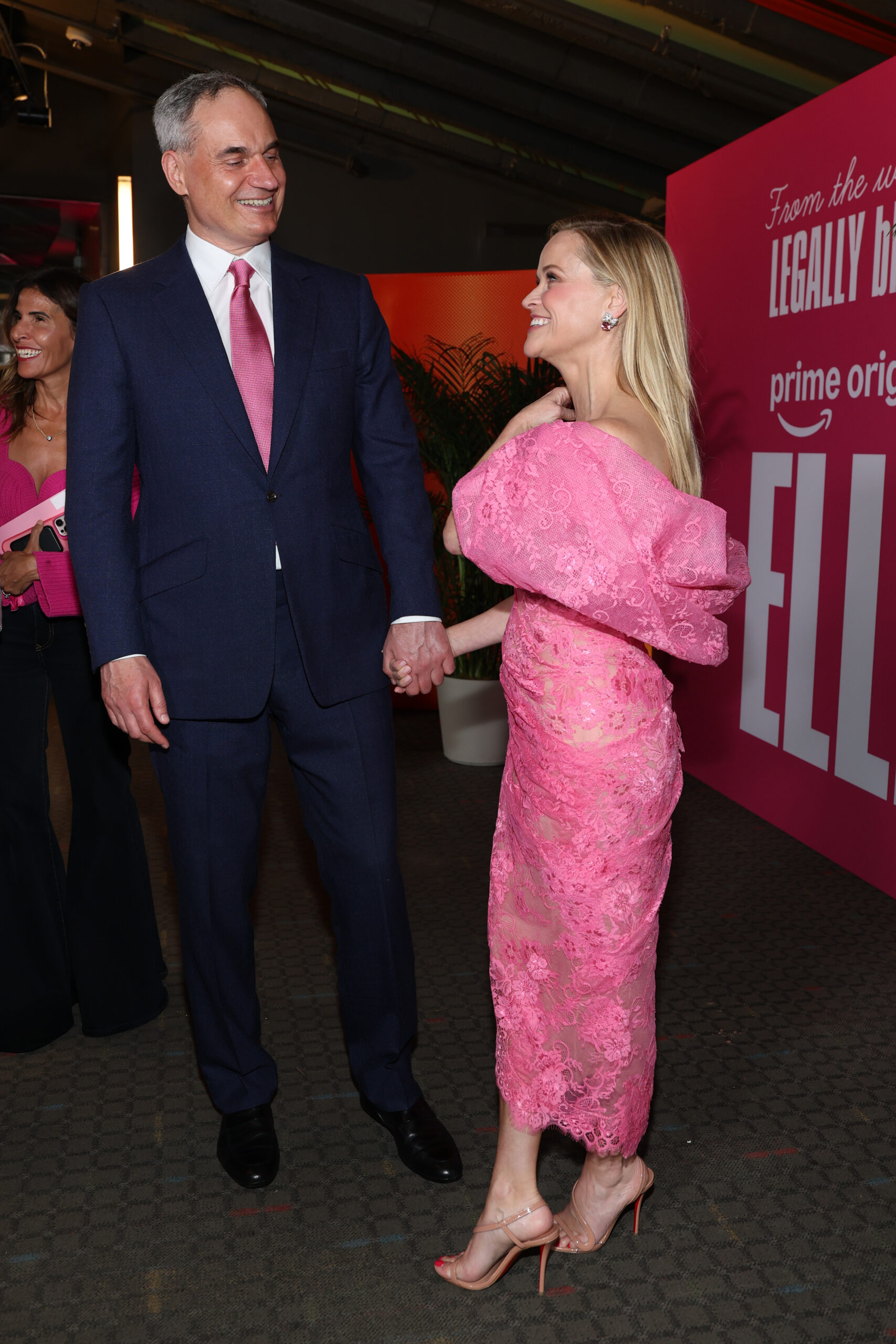 Witherspoon's bold pink look added a playful nod to the "Elle" universe, while Haarmann's coordinating tie made their outing feel intentionally polished. It was the kind of detail fans immediately noticed — and debated.