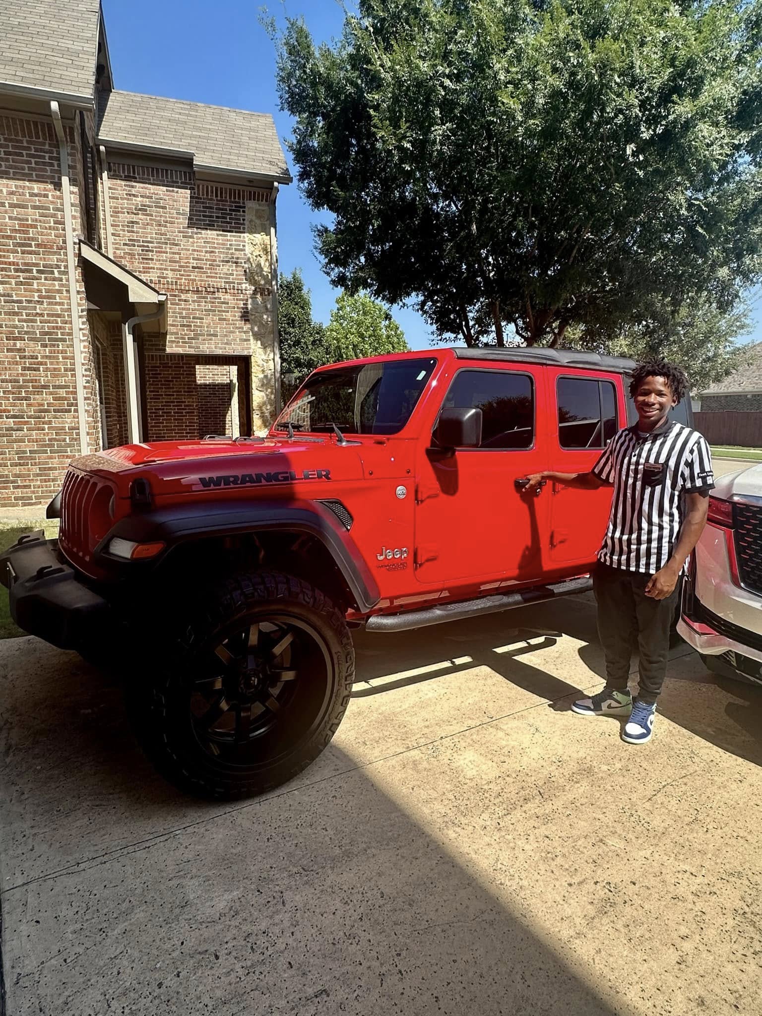 Images tied to Karmelo Anthony's family helped fuel public interest in the lifestyle they appeared to have before the legal case. The red Jeep became one of the vehicle photos that pushed online discussion toward questions about money, image, and perception.