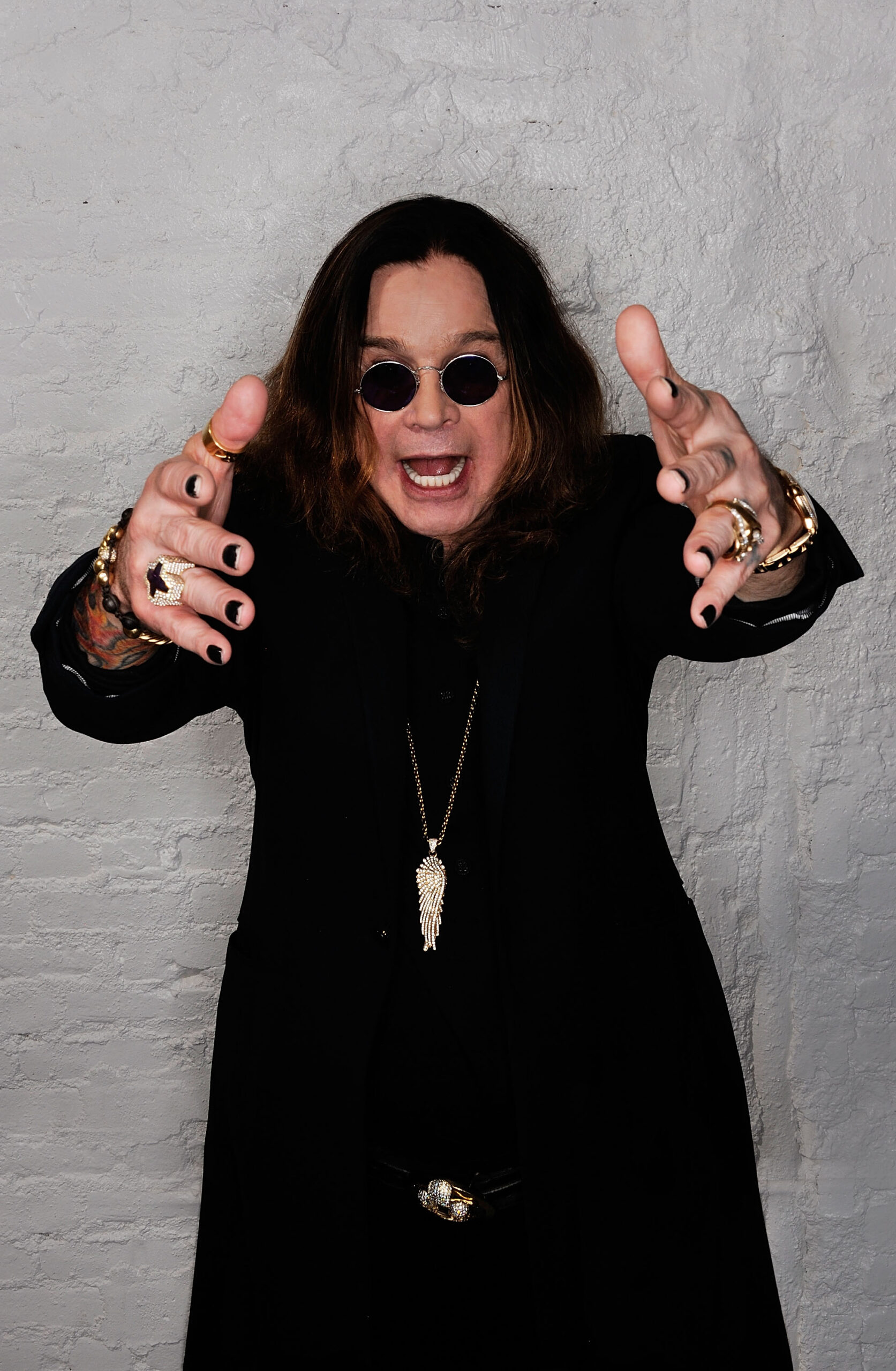 Ozzy Osbourne poses with his arms outstretched during a portrait session at the 2011 Tribeca Film Festival in New York City. The heavy metal icon died in July 2025 at age 76, leaving behind a legacy that continues to be celebrated by his family and fans.
