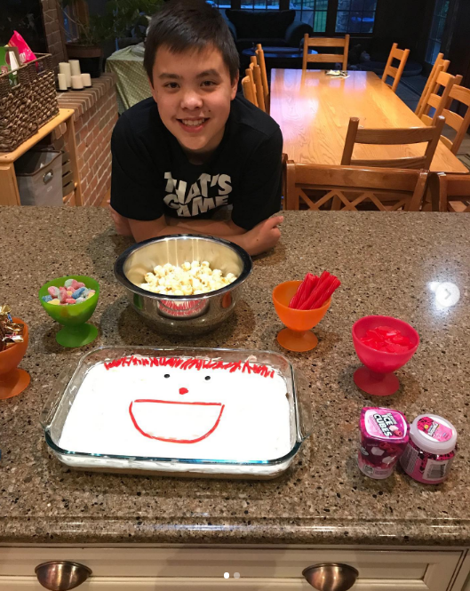 Joel stayed focused on his academic goals and was set to graduate in 2027. On this occasion, he posed with a cake at home on May 13, 2019.