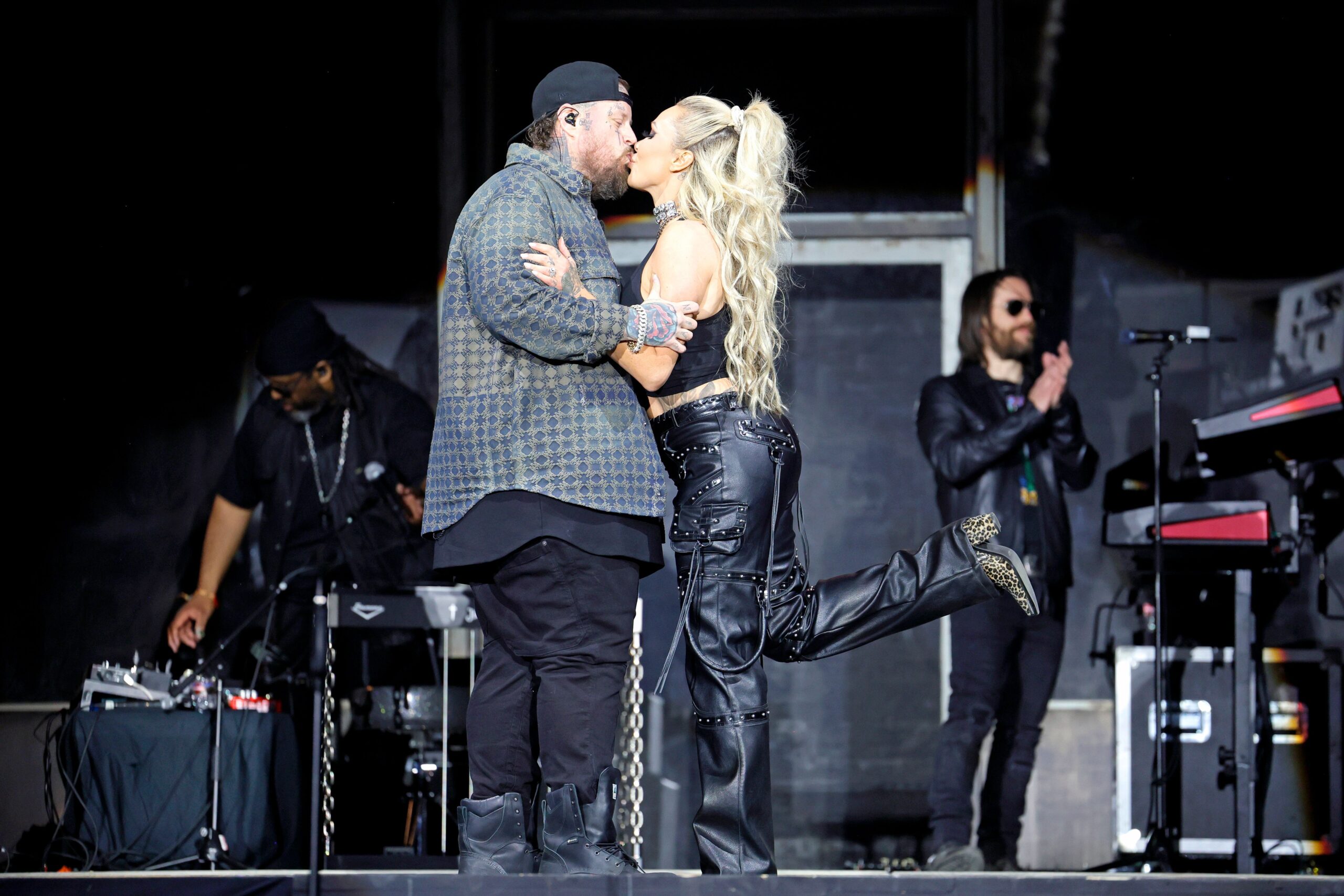 Jelly Roll and Bunnie XO share a kiss onstage during a performance, offering a glimpse of the affectionate partnership they often displayed publicly. The image has taken on new meaning after reports revealed the pair, who are divorcing after nearly 10 years of marriage, had "always had a complicated dynamic.