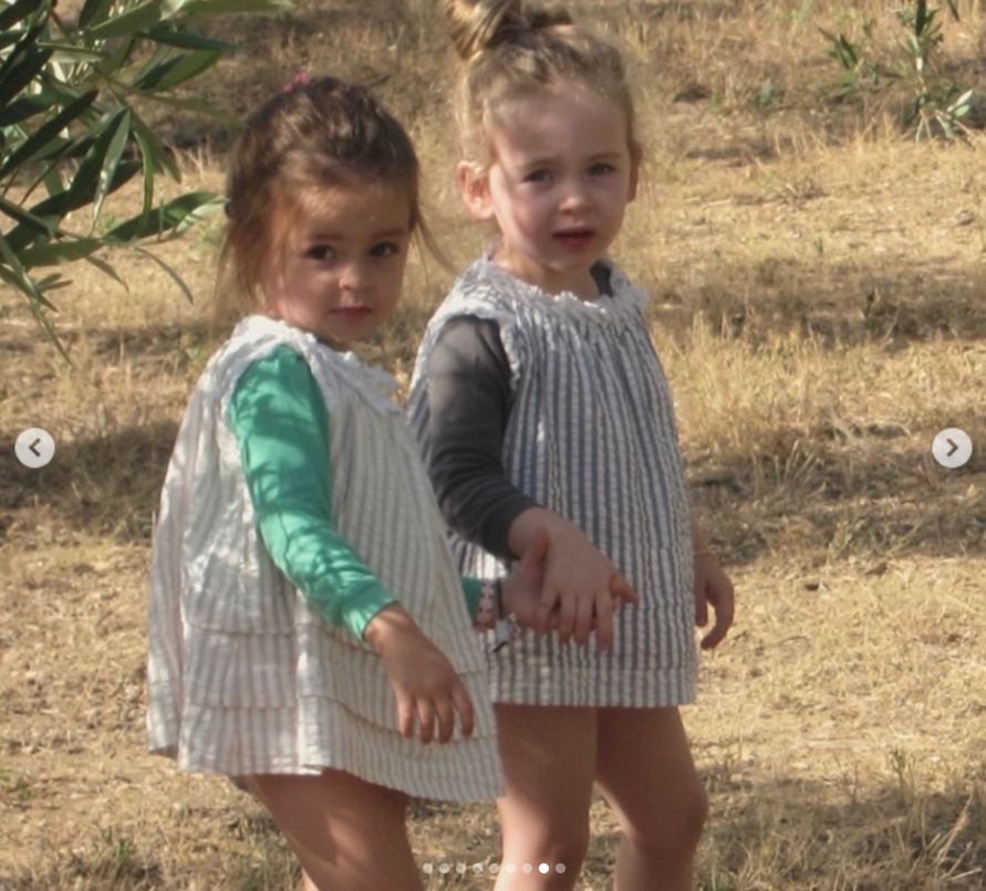Tabitha and Marion hold hands while exploring a grassy landscape in another childhood photo Sarah Jessica Parker included in her birthday tribute.