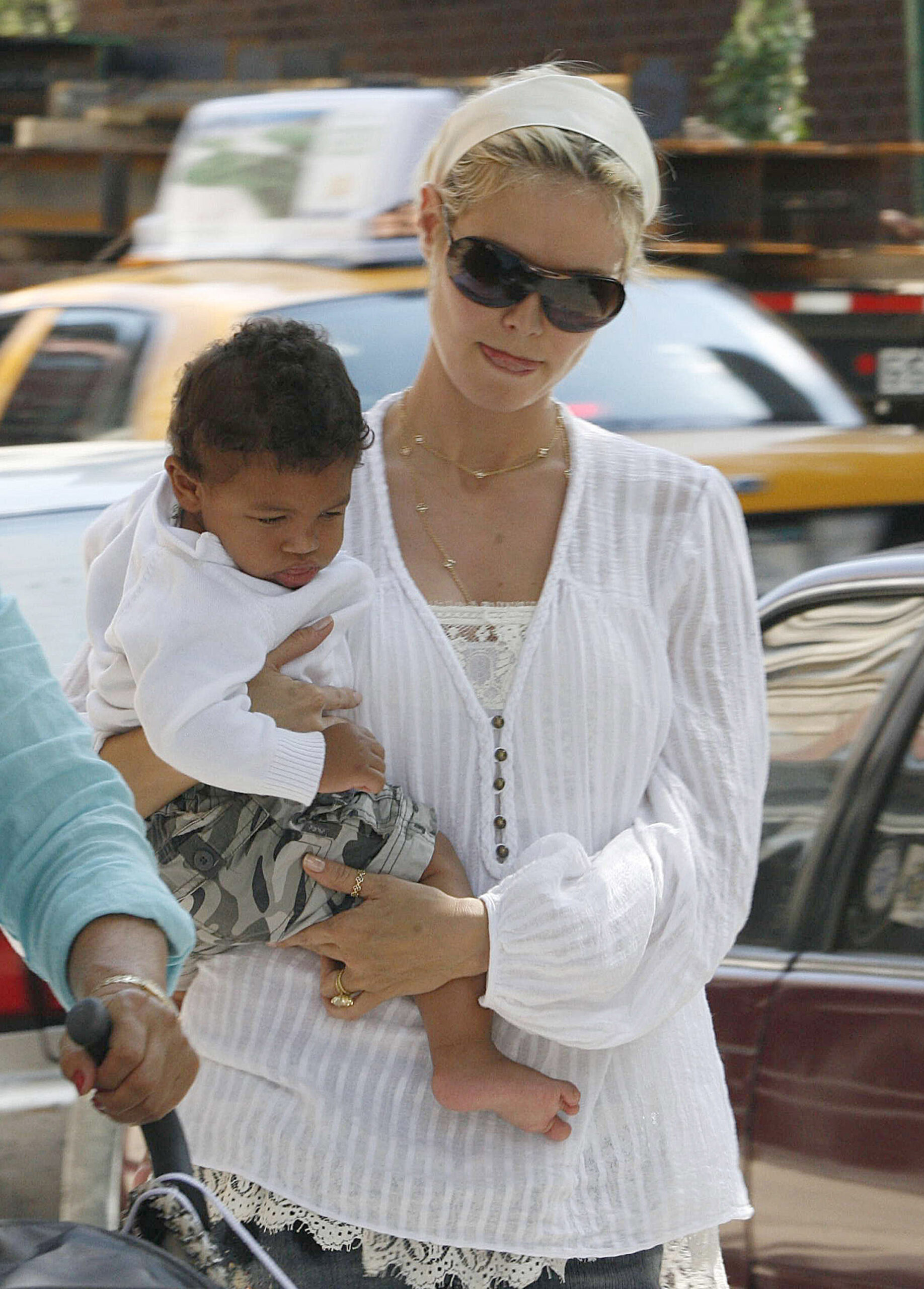 Heidi Klum seen holding her son Henry Samuel in New York City on June 15, 2006.