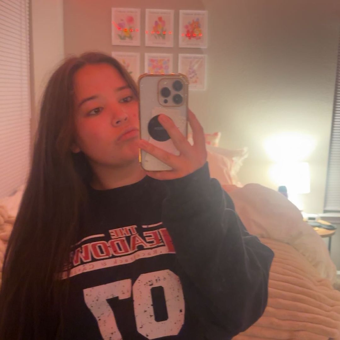 Leah built a popular following on TikTok by actively participating in the "BookTok" community. In this photo, she posed for a selfie during a video update.