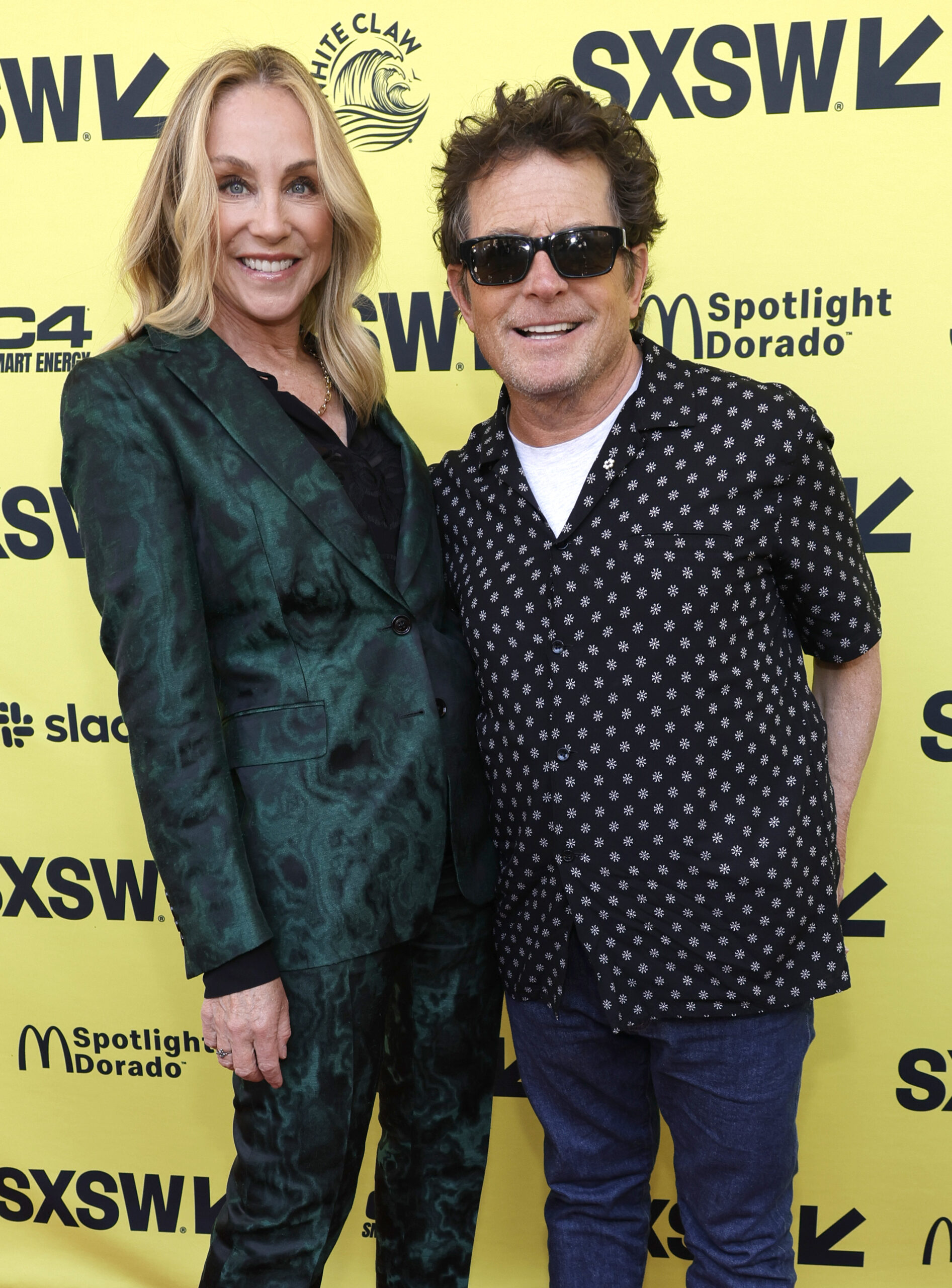 Exuding confidence on the vibrant yellow carpet at SXSW, the couple celebrated the premiere of "Still: A Michael J. Fox Movie." The intimate Apple TV+ documentary pulled back the curtain on Michael's life, career, and private health battles, offering a raw and vulnerable story that wouldn't have been complete without Tracy at its core.