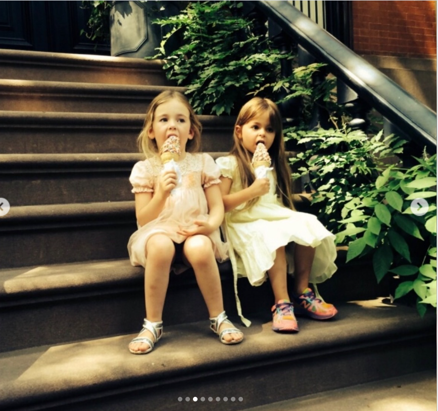 Tabitha and Marion enjoy ice cream on the steps of a brownstone in one of the nostalgic childhood photos Sarah Jessica Parker shared for their 17th birthday.