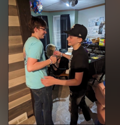 Family members share a moment together in an undated photo later included on a GoFundMe page created to support the sole surviving sibling following the Muscatine, Iowa, family tragedy. The fundraiser was launched by friends to help with funeral, counseling, and living expenses.