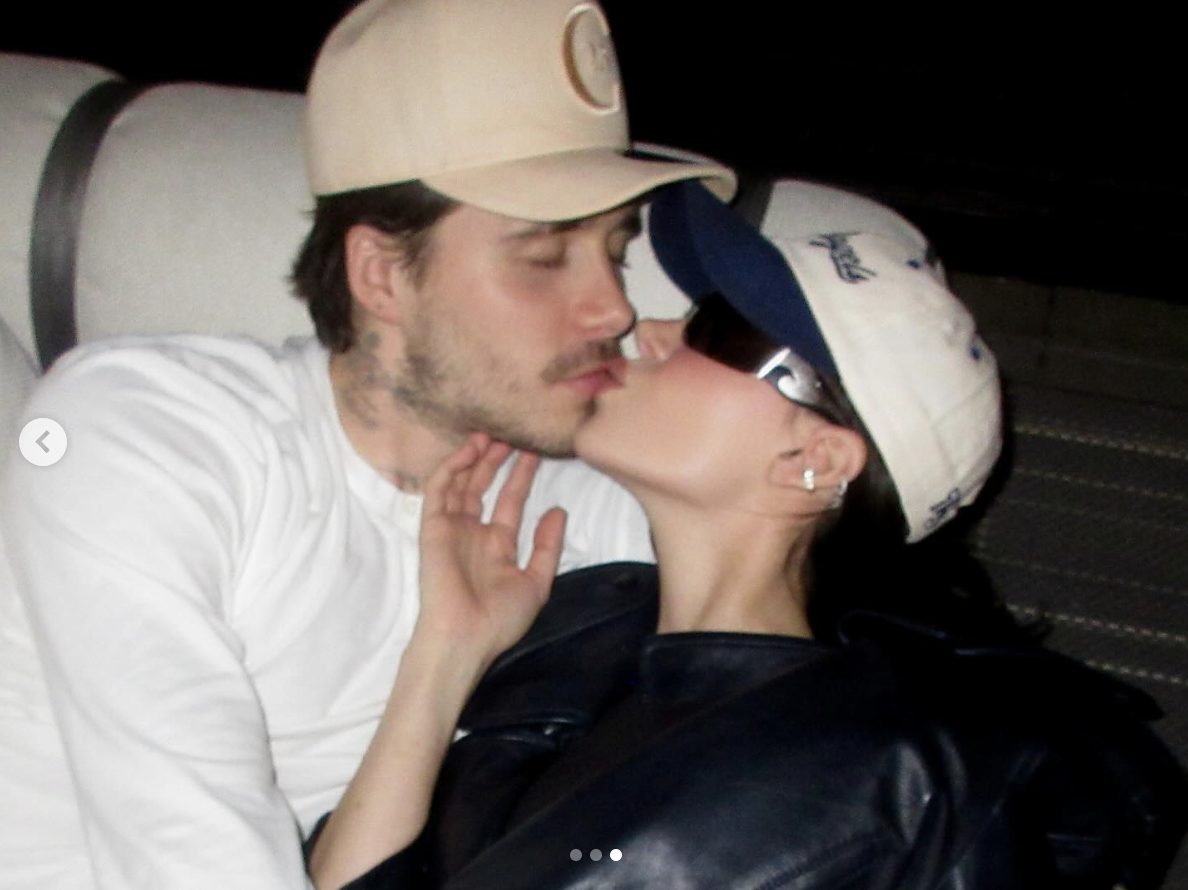 Brooklyn Beckham and Nicola Peltz share a kiss, as seen in a photo dated April 29, 2025