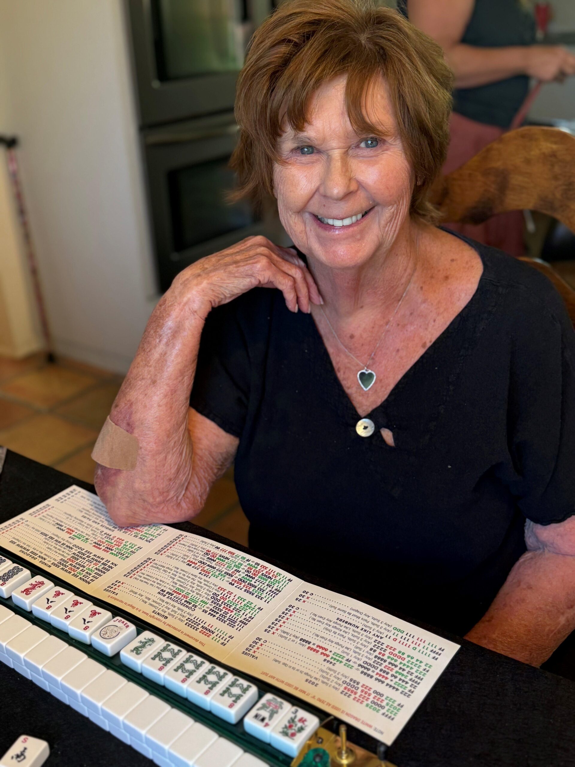 Nancy Guthrie, mother of "Today" show anchor Savannah Guthrie, smiling while playing Mahjong.