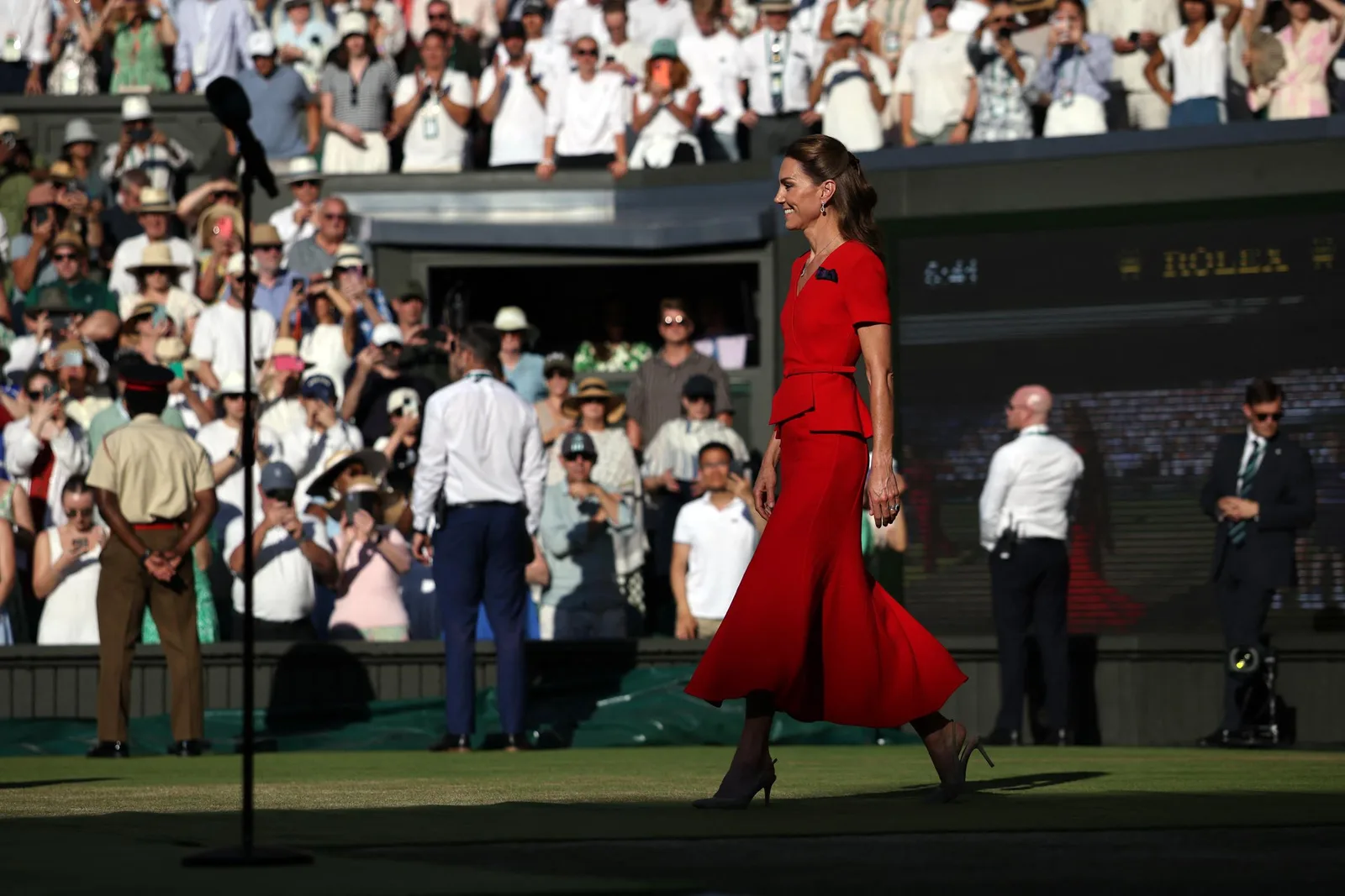 Walking onto Centre Court, Catherine prepared to present the trophy after the women's singles final. The ceremony is one of the most anticipated traditions of Wimbledon weekend.