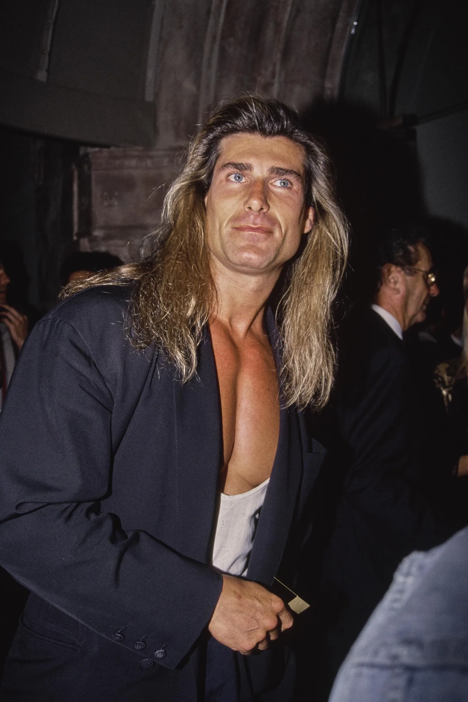 Another opportunity came just as quickly for the male model. In this photo, the iconic romance book cover star attended the "Pauly Does Dallas" premiere after party at the Comedy Store in Los Angeles, California, on August 26, 1992.