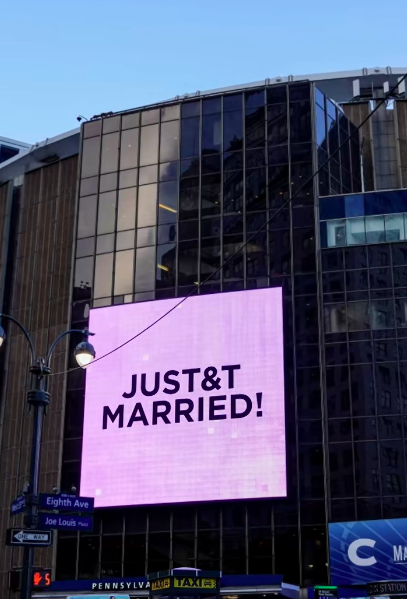 Madison Square Garden's exterior carried one of the most public nods to Taylor Swift and Travis Kelce's wedding after days of intense secrecy around the event. The "JUST&T MARRIED!" message echoed the couple's T&T branding that appeared throughout the celebration.