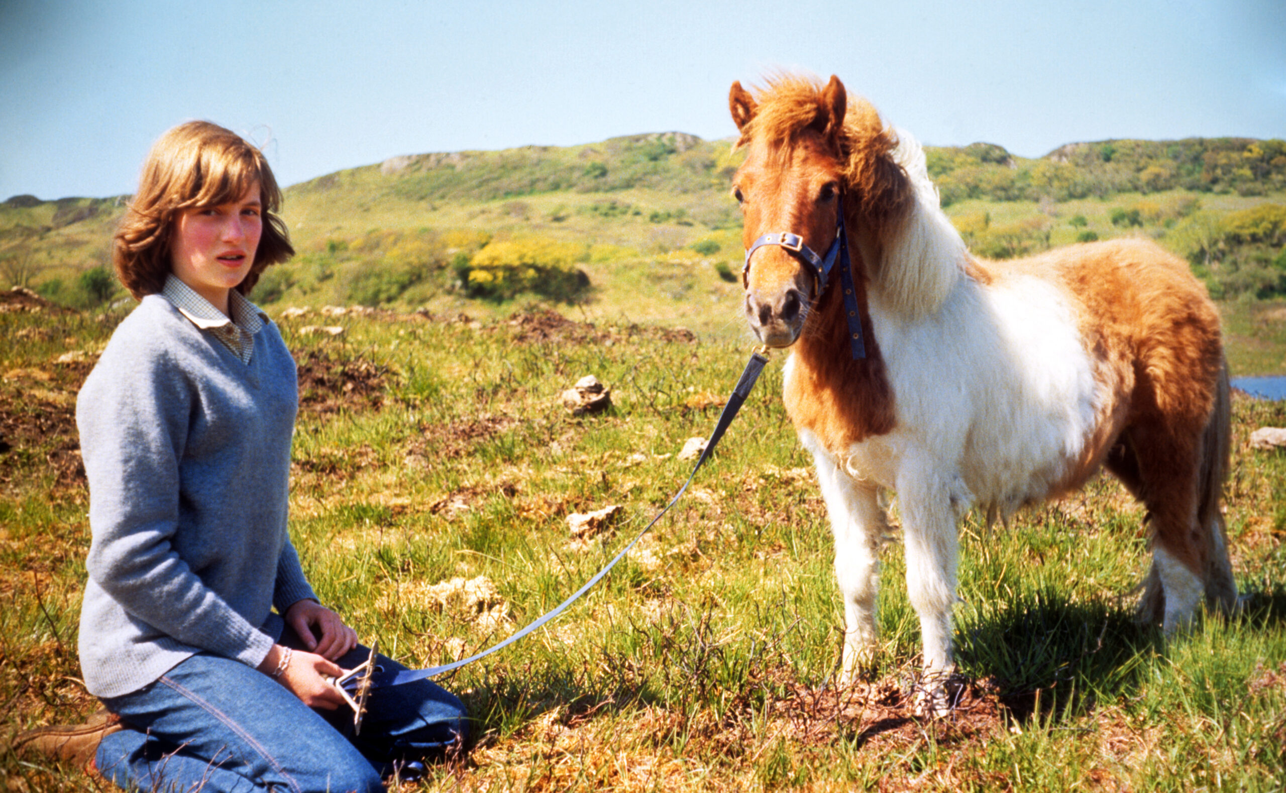 Diana, Princess of Wales, photographed with a pony at her mother's home in Scotland during the summer of 1974.