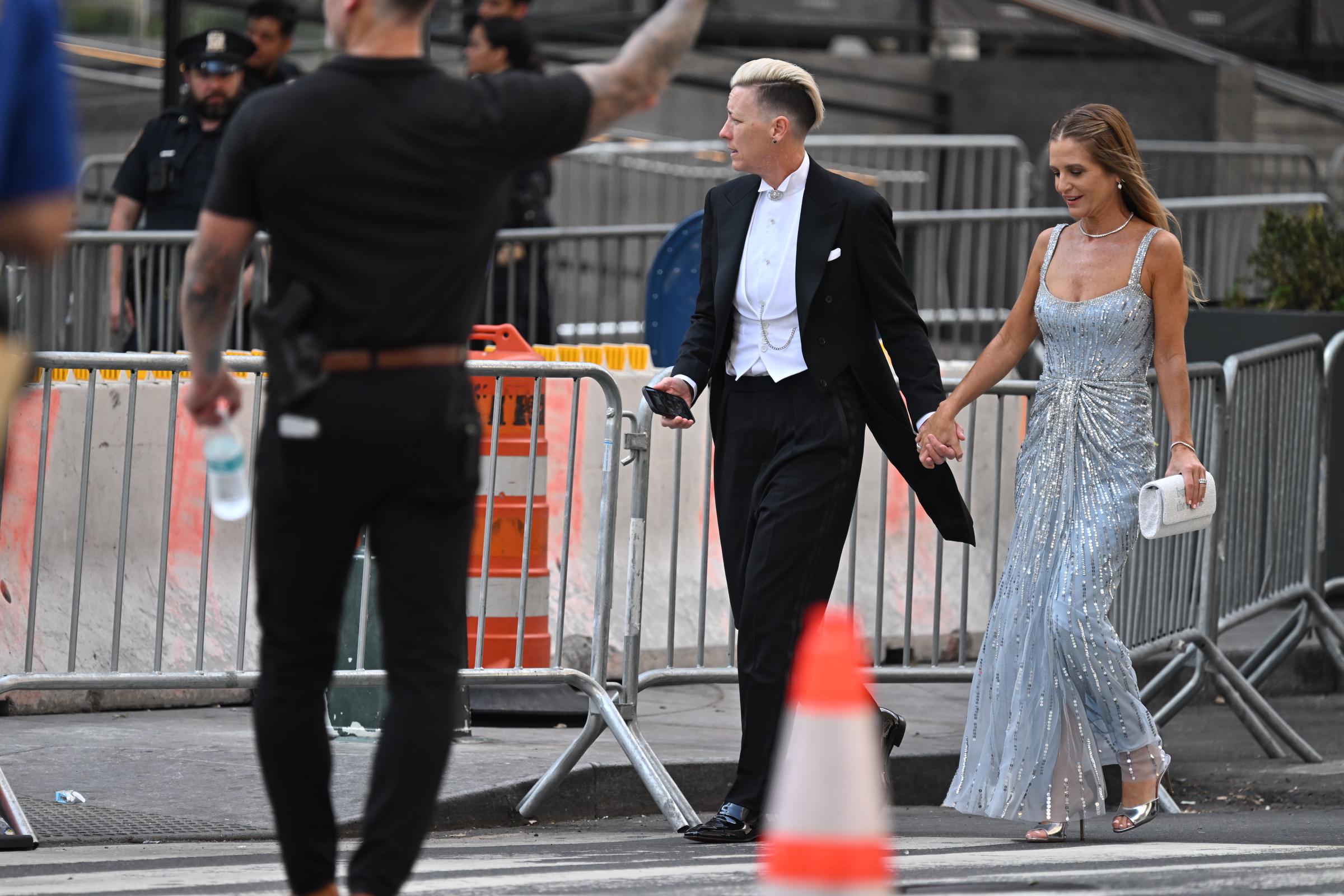 Abby Wambach and her wife, Glennon Doyle, arrive at Madison Square Garden on July 3, 2026, for Taylor Swift and Travis Kelce's wedding. Vogue reported that they were among the guests at the celebration.