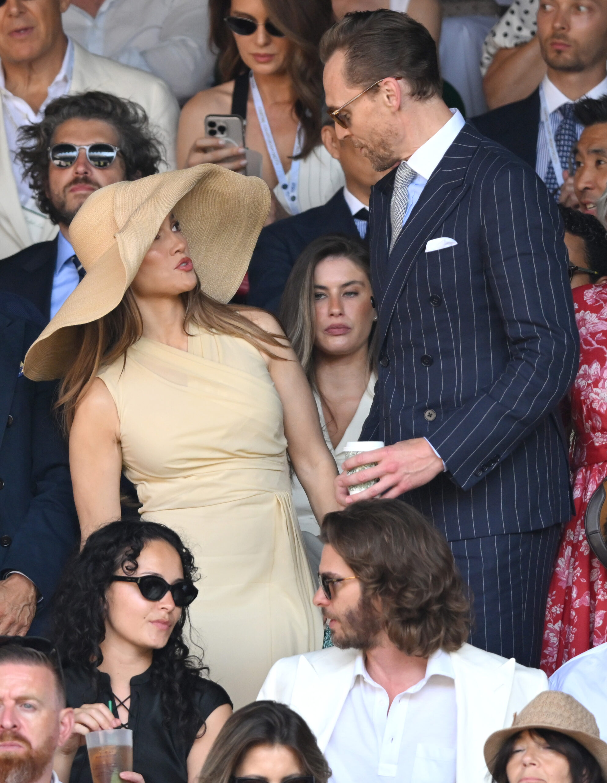 Lopez spent part of the final alongside Actor Tom Hiddleston, while Andrew Garfield was seated in the row below. Their proximity helped the images spread rapidly as viewers scrutinized the scale of her headwear.