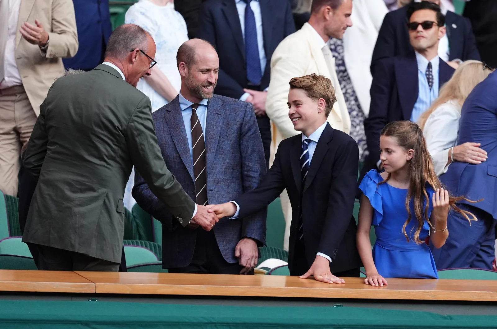 Prince George greeted German Chancellor Friedrich Merz before taking his seat in the Royal Box. The moment highlighted the formal traditions that accompany Wimbledon finals.