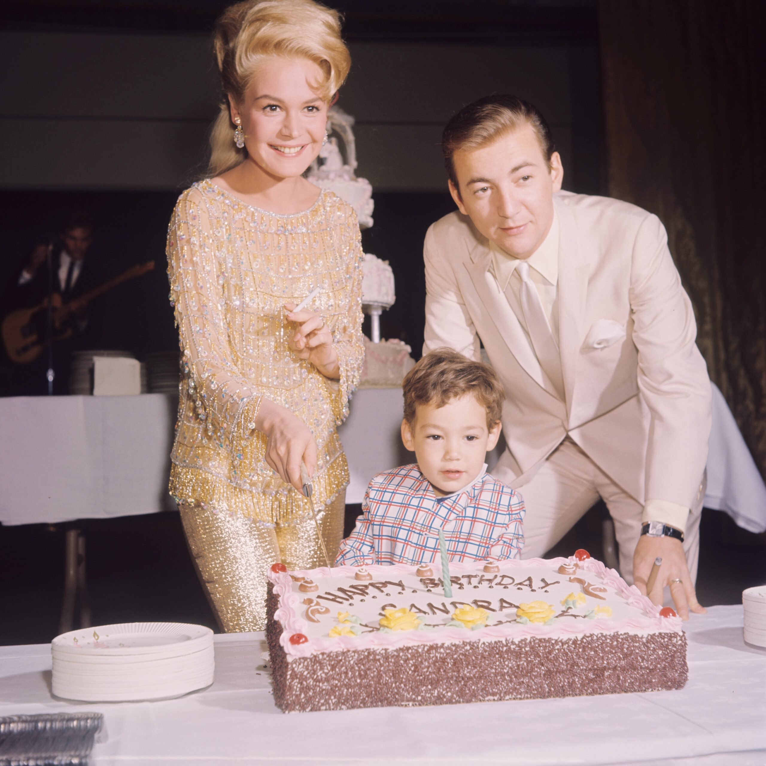 American singer Bobby Darin (1936 - 1973) celebrates the birthday of his wife, actress Sandra Dee (1942 - 2005), with their son Dodd, circa 1966.