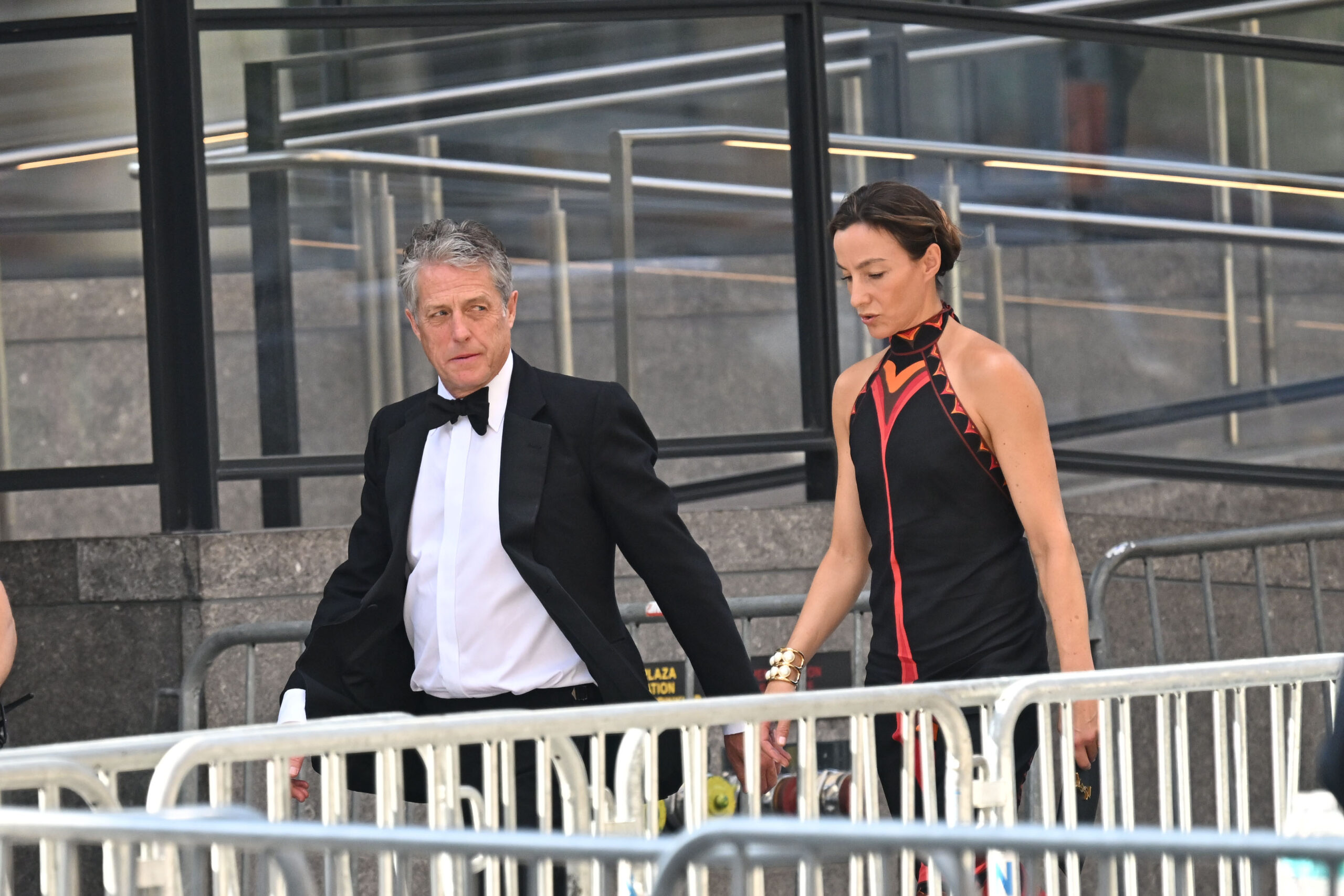 Hugh Grant and his wife, Anna Elisabet Eberstein, arrive at Madison Square Garden on July 3, 2026, for Taylor Swift and Travis Kelce's wedding. The actor was among the celebrity guests seen arriving at the venue.
