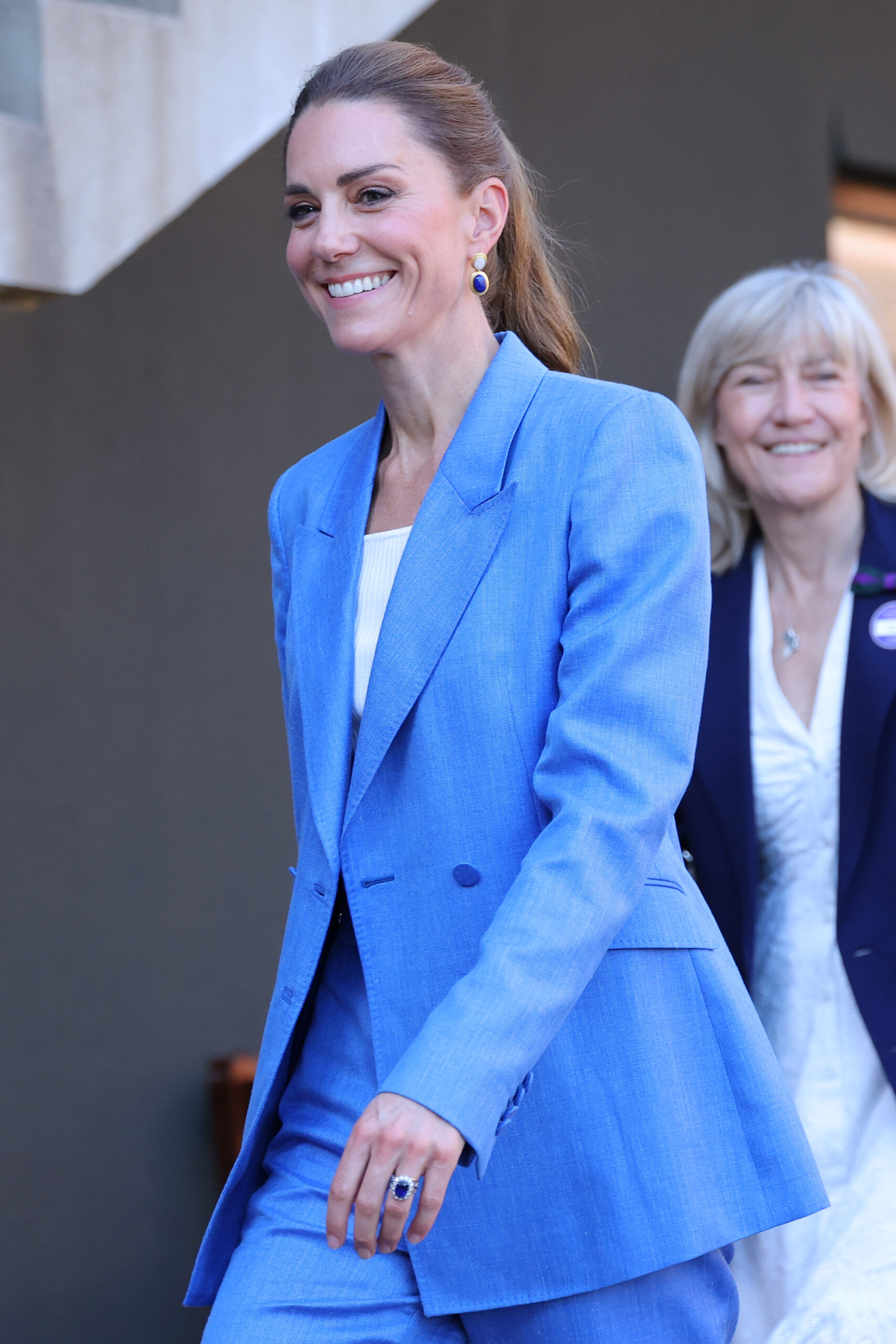 Catherine, Princess of Wales, smiled warmly as an avid tennis supporter.