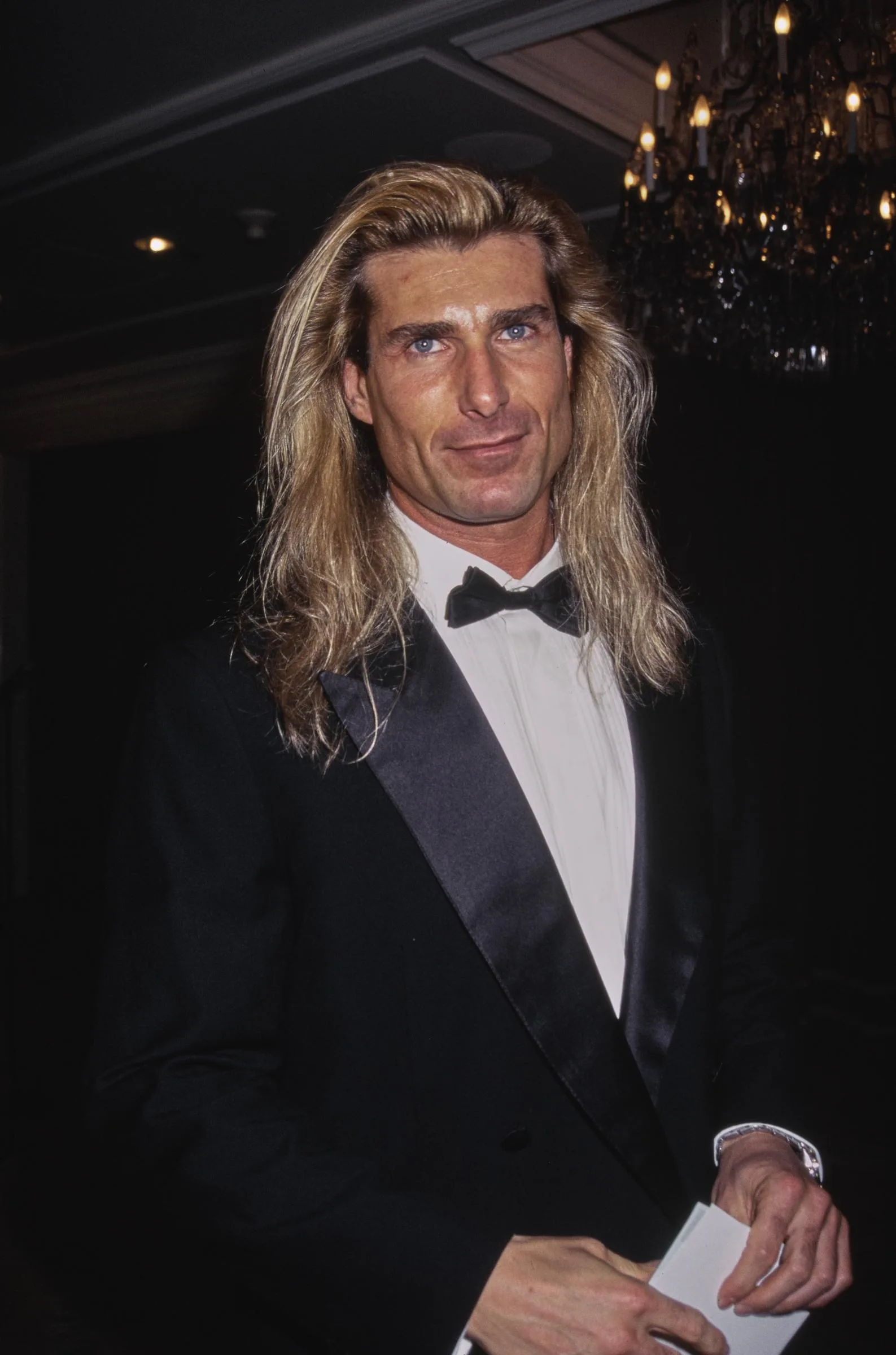 His stunning looks were no accident, as he maintained a remarkably disciplined workout routine. In this photo, he wore a tuxedo and bow tie while attending the 32nd Annual National Association of Television Program Executives Convention and Exhibition at the Sands Expo Center in Las Vegas, Nevada, on January 23, 1995.